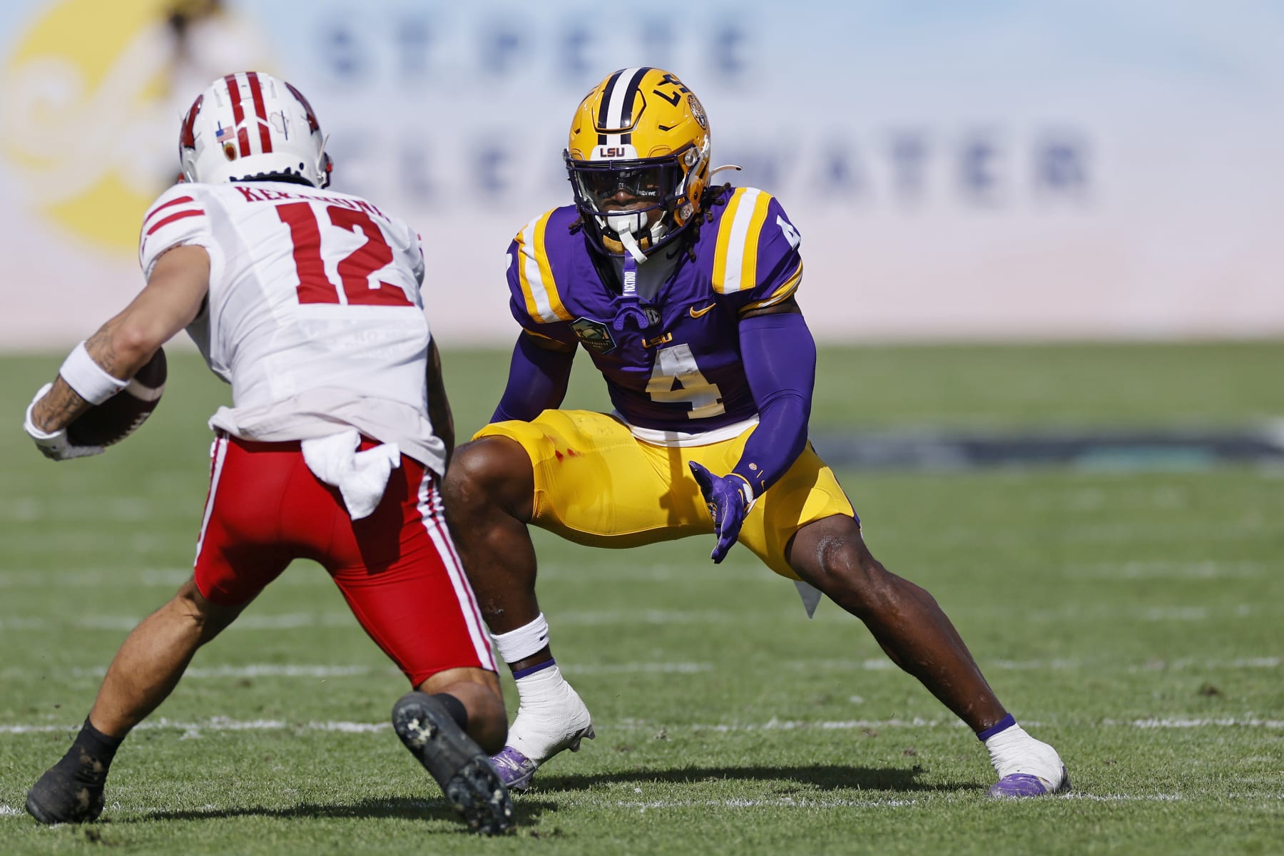 TAMPA, FL - JANUARY 01: LSU Tigers linebacker Harold Perkins Jr. (4) looks to make a tackle during the ReliaQuest Bowl against the Wisconsin Badgers on January 1, 2024 at Raymond James Stadium in Tampa, Florida. (Photo by Joe Robbins/Icon Sportswire via Getty Images)