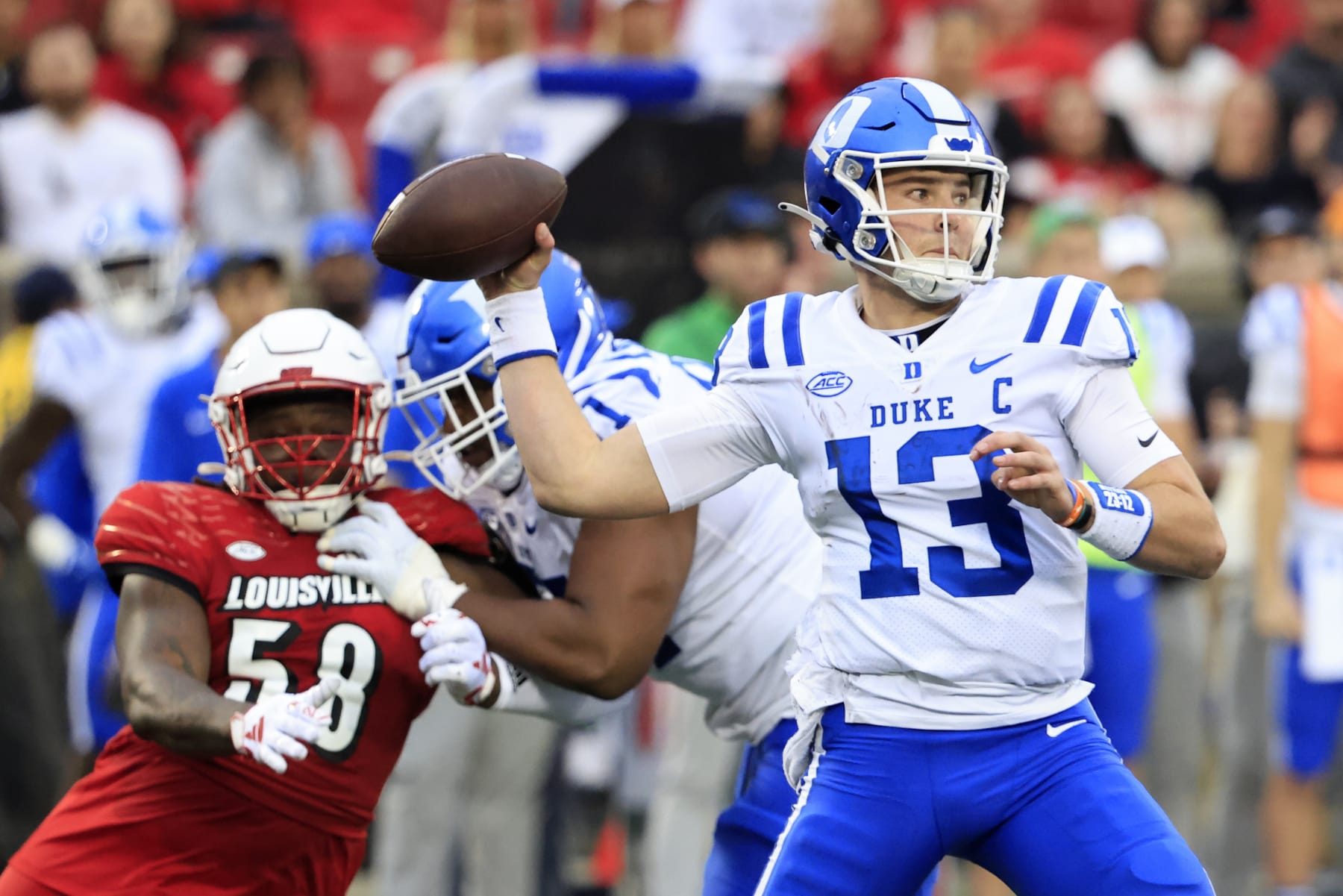 LOUISVILLE, KENTUCKY - OCTOBER 28: Riley Leonard #13 of the Duke Blue Devils throws a pass during the second half in the game against the Louisville Cardinals at Cardinal Stadium on October 28, 2023 in Louisville, Kentucky. (Photo by Justin Casterline/Getty Images)