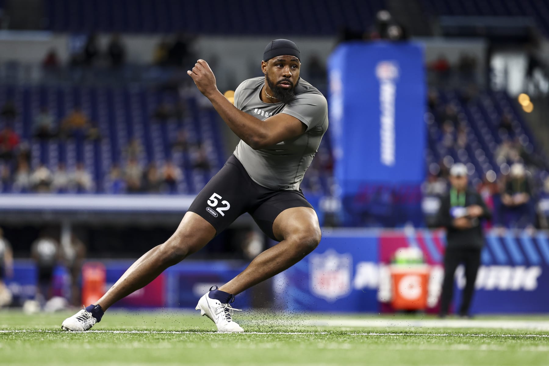 INDIANAPOLIS, INDIANA - FEBRUARY 29: Eric Watts #DL52 of Connecticut participates in a drill during the NFL Combine at Lucas Oil Stadium on February 29, 2024 in Indianapolis, Indiana. (Photo by Kevin Sabitus/Getty Images)