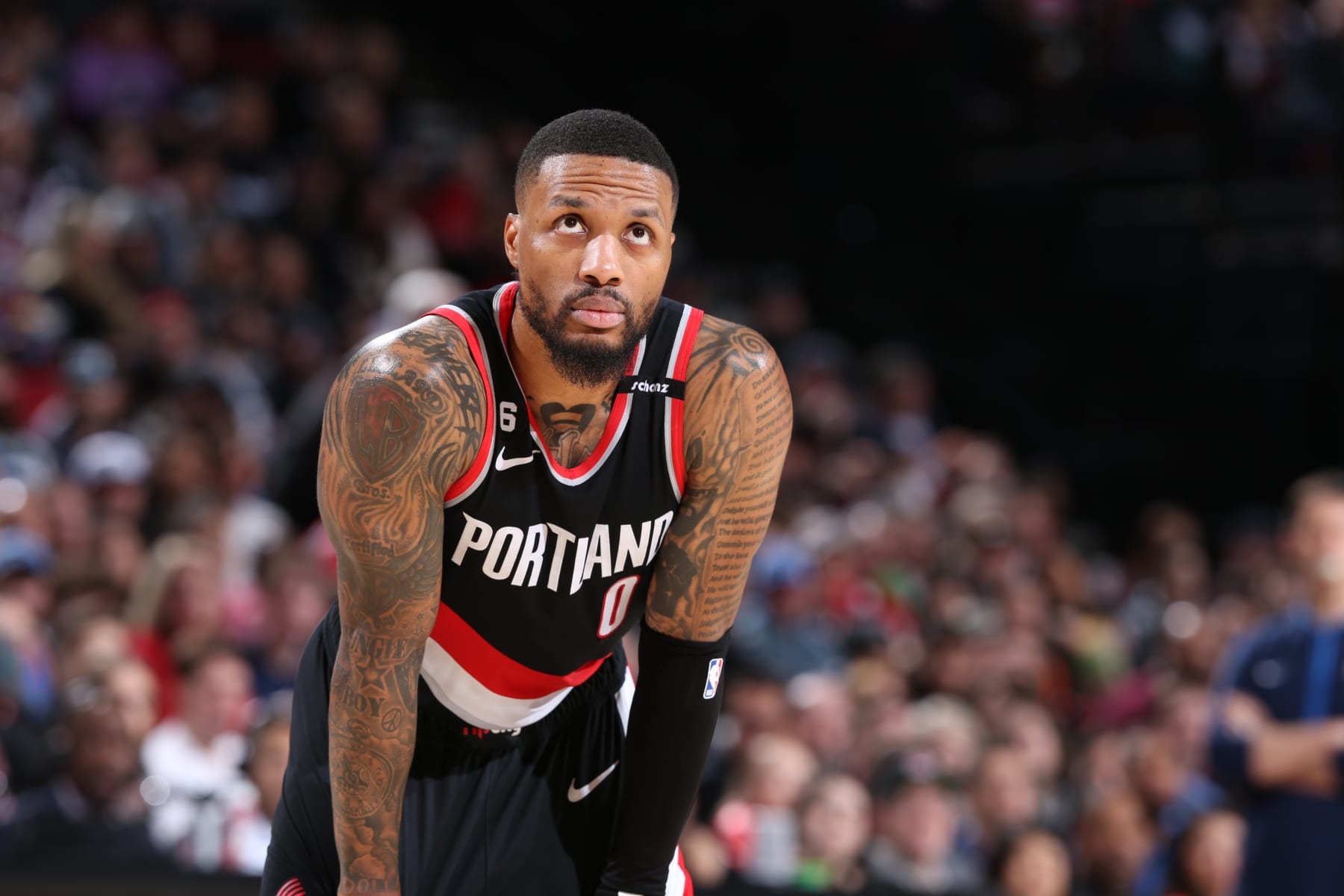 PORTLAND, OR - FEBRUARY 10: Damian Lillard #0 of the Portland Trail Blazers looks on during the game against the Oklahoma City Thunder on February 10, 2023 at the Moda Center Arena in Portland, Oregon. NOTE TO USER: User expressly acknowledges and agrees that, by downloading and or using this photograph, user is consenting to the terms and conditions of the Getty Images License Agreement. Mandatory Copyright Notice: Copyright 2023 NBAE (Photo by Sam Forencich/NBAE via Getty Images)