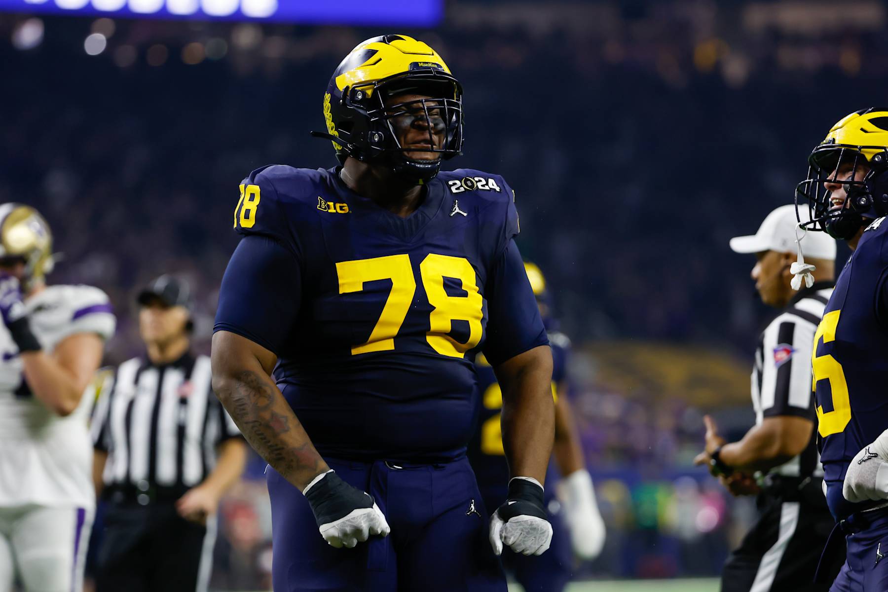 HOUSTON, TX - JANUARY 08: Michigan Wolverines defensive lineman Kenneth Grant (78) celebrates a sack during the CFP National Championship game Michigan Wolverines and Washington Huskies on January 8, 2024, at NRG Stadium in Houston, Texas. (Photo by David Buono/Icon Sportswire via Getty Images)