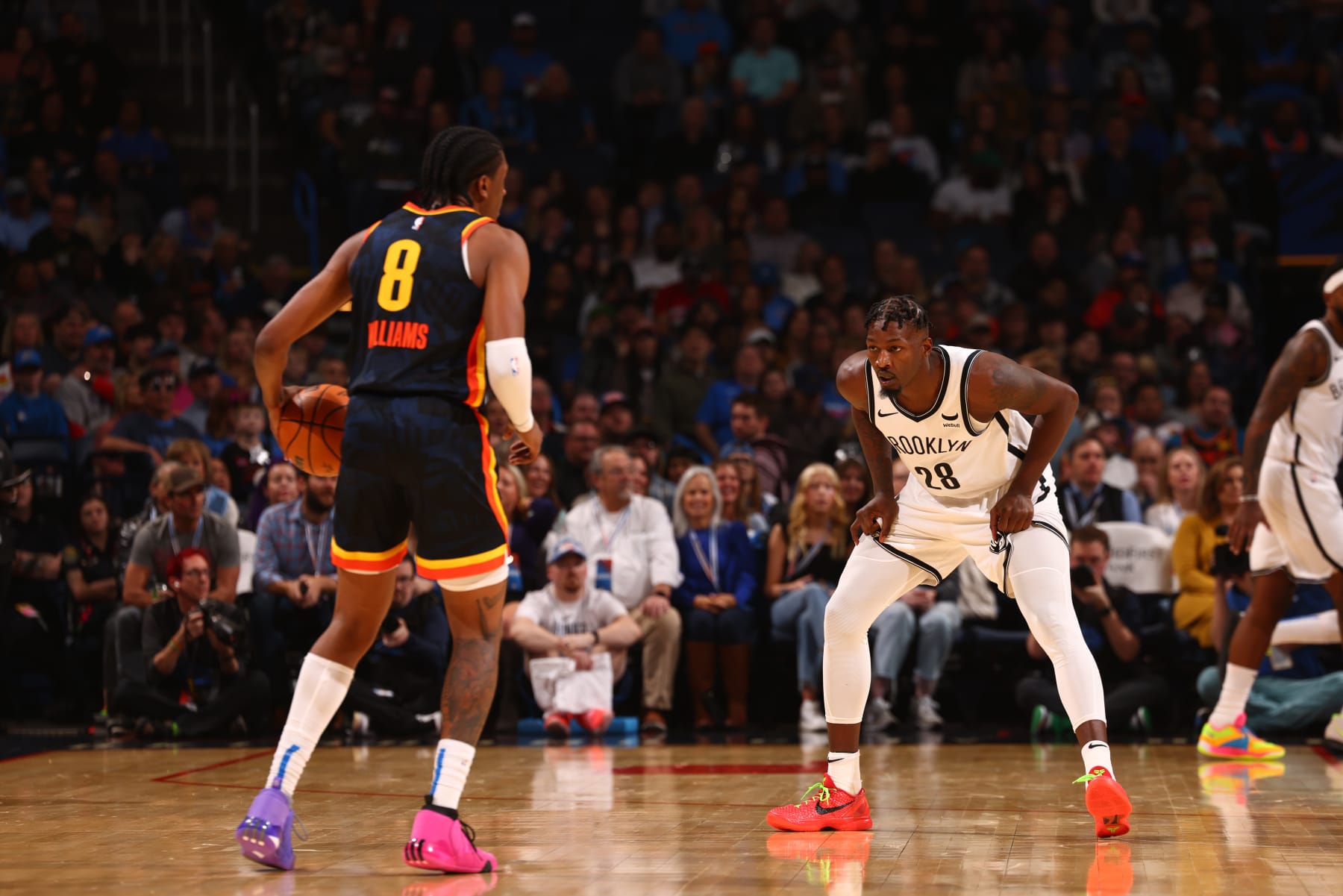 OKLAHOMA CITY, OK - DECEMBER 31: Dorian Finney-Smith #28 of the Brooklyn Nets plays defense against Jalen Williams #8 of the Oklahoma City Thunder during the game on December 31, 2023 at Paycom Arena in Oklahoma City, Oklahoma. NOTE TO USER: User expressly acknowledges and agrees that, by downloading and or using this photograph, User is consenting to the terms and conditions of the Getty Images License Agreement. Mandatory Copyright Notice: Copyright 2023 NBAE (Photo by Zach Beeker/NBAE via Getty Images)