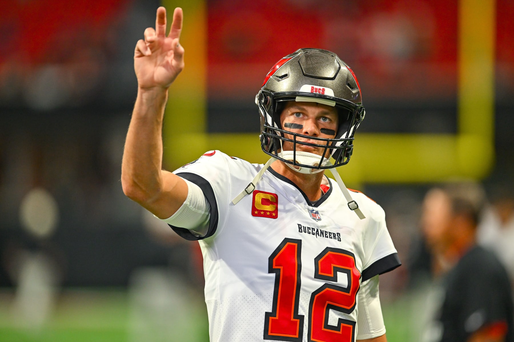 ATLANTA, GA JANUARY 08: Tampa Bay quarterback Tom Brady (12) waves to fans prior to the start of the NFL game between the Tampa Bay Buccaneers and the Atlanta Falcons on January 8th, 2023 at Mercedes-Benz Stadium in Atlanta, GA. (Photo by Rich von Biberstein/Icon Sportswire via Getty Images) ATLANTA, GA JANUARY 08: Tampa Bay quarterback Tom Brady (12) waves to fans prior to the start of the NFL game between the Tampa Bay Buccaneers and the Atlanta Falcons on January 8th, 2023 at Mercedes-Benz Stadium in Atlanta, GA. (Photo by Rich von Biberstein/Icon Sportswire via Getty Images)