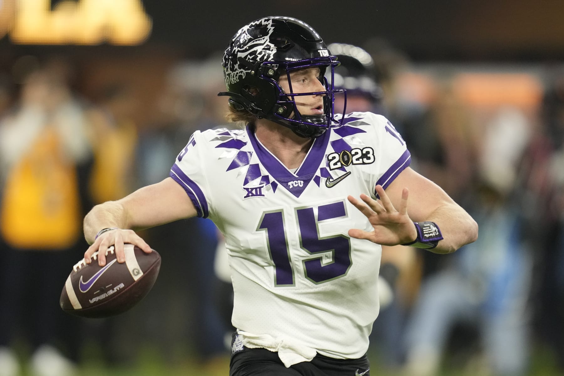 TCU quarterback Max Duggan (15) moves in the pocket against Georgia during the first half of the national championship NCAA College Football Playoff game, Monday, Jan. 9, 2023, in Inglewood, Calif. (AP Photo/Ashley Landis)
