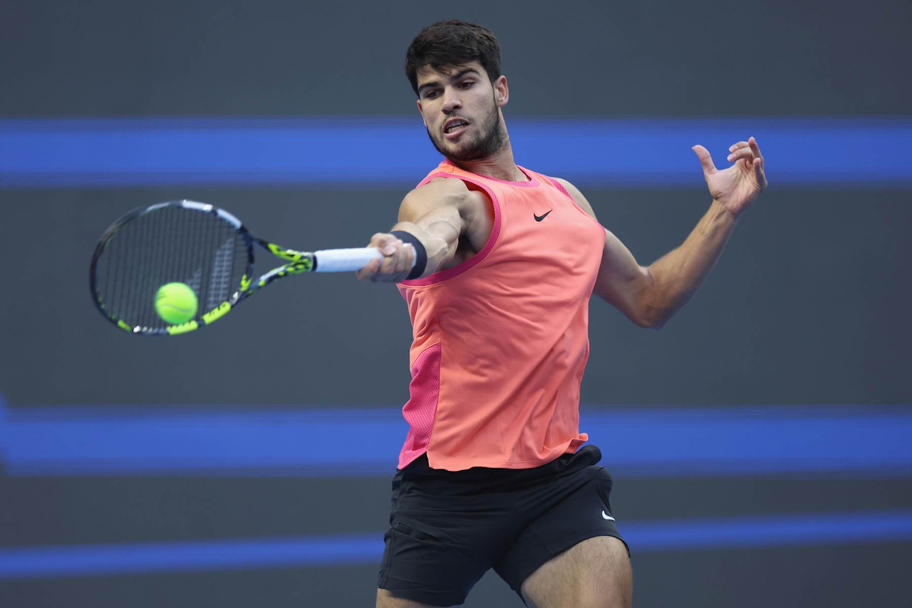 BEIJING, CHINA - OCTOBER 02: Carlos Alcaraz of Spain returns a shot in the Men's singles final match against Jannik Sinner of Italy on Day 10 of the China Open at National Tennis Center on October 02, 2024 in Beijing, China. (Photo by Lintao Zhang/Getty Images)