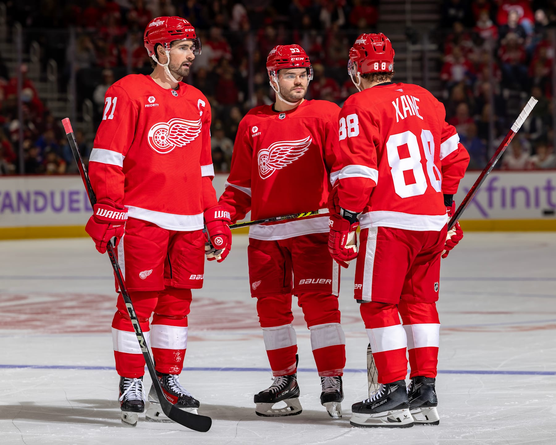 Dylan Larkin, Alex DeBrincat and Patrick Kane.