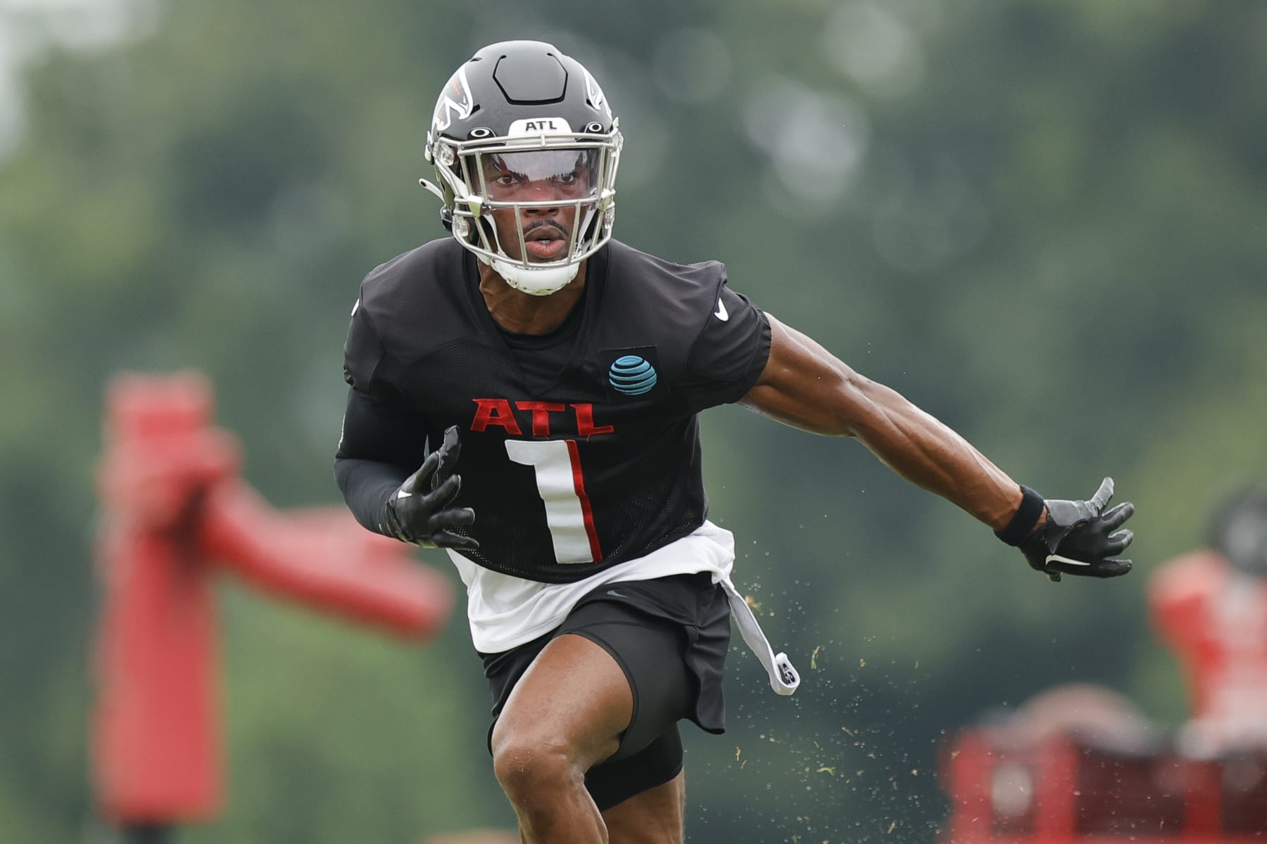 Atlanta Falcons cornerback Jeff Okudah (1) runs a drill during the NFL football team's training camp, Saturday, July 29, 2023, in Flowery Branch, Ga. (AP Photo/Alex Slitz)