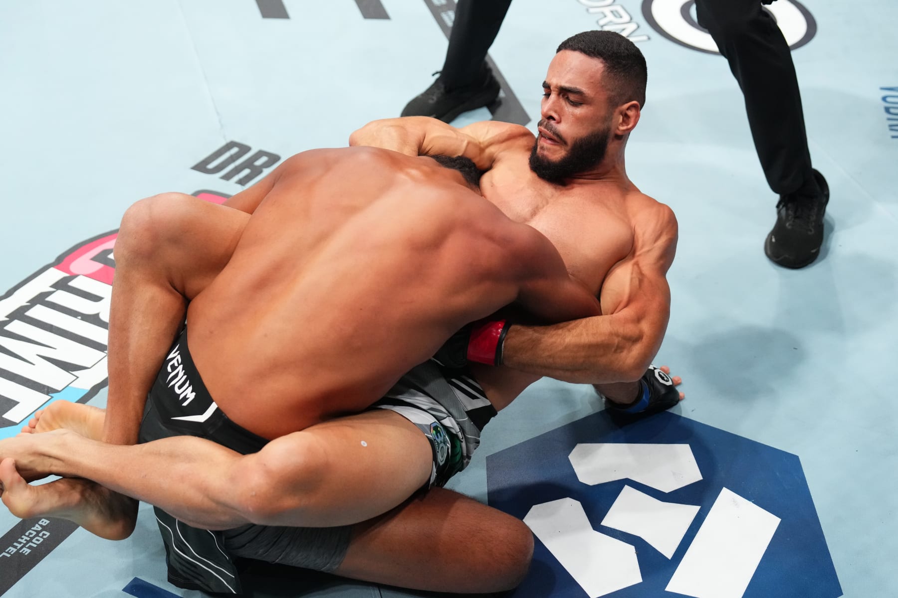 SALT LAKE CITY, UTAH - JULY 29: (R-L) Gabriel Bonfim of Brazil submits Trevin Giles in a welterweight fight during the UFC 291 event at Delta Center on July 29, 2023 in Salt Lake City, Utah. (Photo by Josh Hedges/Zuffa LLC via Getty Images)