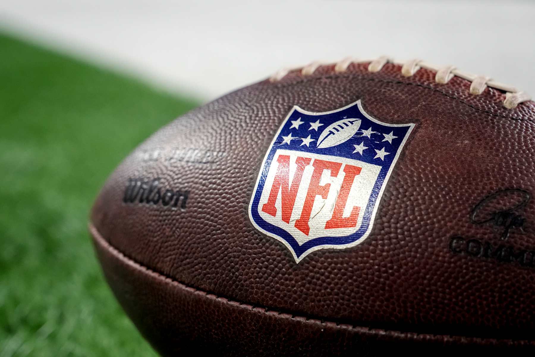 DETROIT, MICHIGAN - DECEMBER 15: A detailed view of the NFL logo on a Wilson brand football on the field before the game between the Detroit Lions and Buffalo Bills at Ford Field on December 15, 2024 in Detroit, Michigan. (Photo by Nic Antaya/Getty Images)