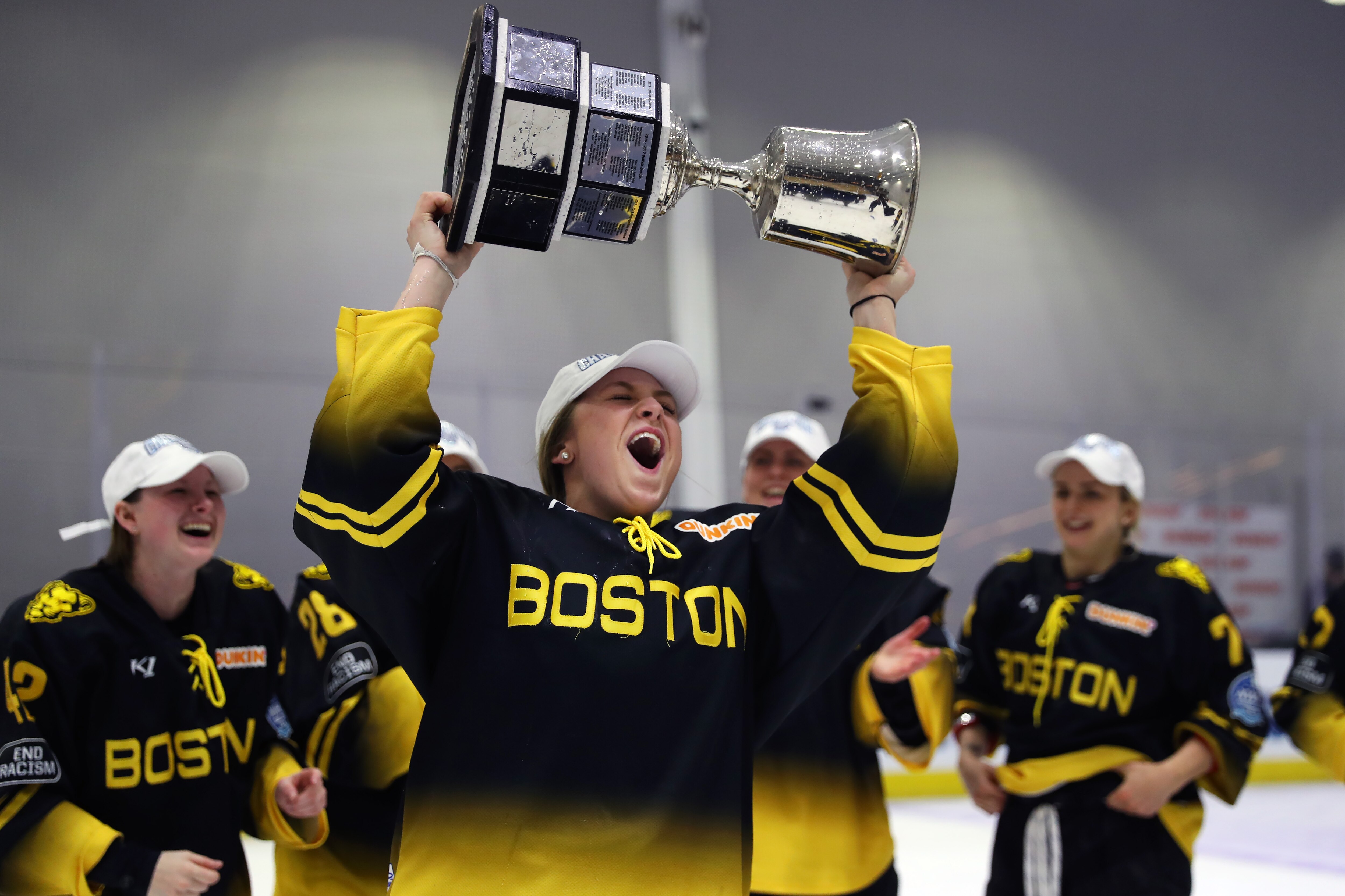 BOSTON, MASSACHUSETTS - MARCH 27: Lauren Kelly #4 of Boston Pride celebrates after the Pride defeat the Minnesota Whitecaps 4-3 in the NWHL Isobel Cup Championship at Warrior Ice Arena on March 27, 2021 in Boston, Massachusetts. (Photo by Maddie Meyer/Getty Images)