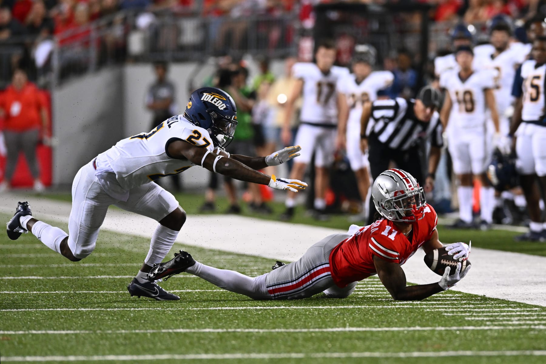 COLUMBUS, OHIO - SEPTEMBER 17: Jaxon Smith-Njigba #11 of the Ohio State Buckeyes makes a diving catch during the second quarter of a game against the Toledo Rockets at Ohio Stadium on September 17, 2022 in Columbus, Ohio. (Photo by Ben Jackson/Getty Images)