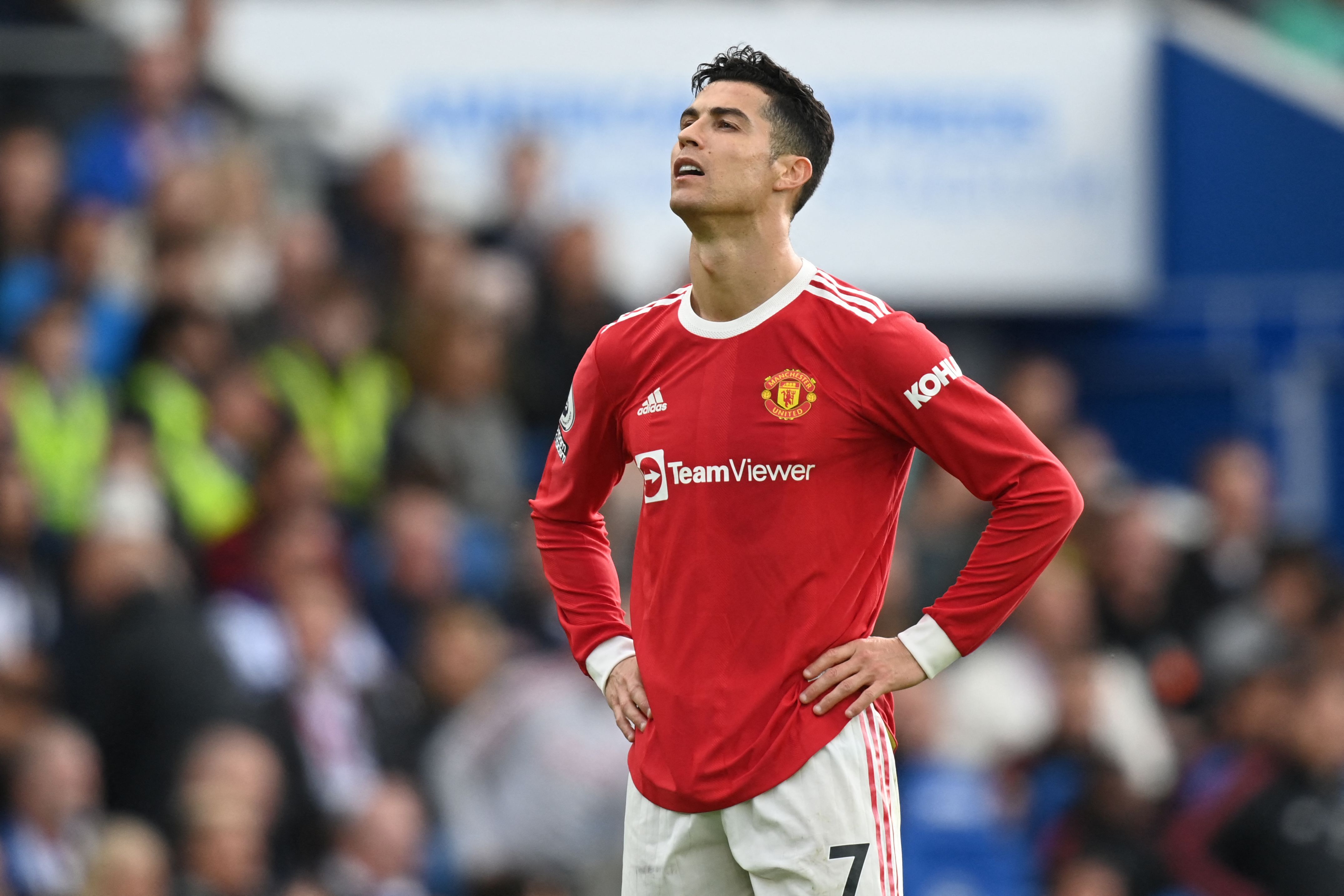 Manchester United's Portuguese striker Cristiano Ronaldo reacts during the English Premier League football match between Brighton and Hove Albion and Manchester United at the American Express Community Stadium in Brighton, southern England on May 7, 2022. - RESTRICTED TO EDITORIAL USE. No use with unauthorized audio, video, data, fixture lists, club/league logos or 'live' services. Online in-match use limited to 120 images. An additional 40 images may be used in extra time. No video emulation. Social media in-match use limited to 120 images. An additional 40 images may be used in extra time. No use in betting publications, games or single club/league/player publications. (Photo by Glyn KIRK / AFP) / RESTRICTED TO EDITORIAL USE. No use with unauthorized audio, video, data, fixture lists, club/league logos or 'live' services. Online in-match use limited to 120 images. An additional 40 images may be used in extra time. No video emulation. Social media in-match use limited to 120 images. An additional 40 images may be used in extra time. No use in betting publications, games or single club/league/player publications. / RESTRICTED TO EDITORIAL USE. No use with unauthorized audio, video, data, fixture lists, club/league logos or 'live' services. Online in-match use limited to 120 images. An additional 40 images may be used in extra time. No video emulation. Social media in-match use limited to 120 images. An additional 40 images may be used in extra time. No use in betting publications, games or single club/league/player publications. (Photo by GLYN KIRK/AFP via Getty Images)