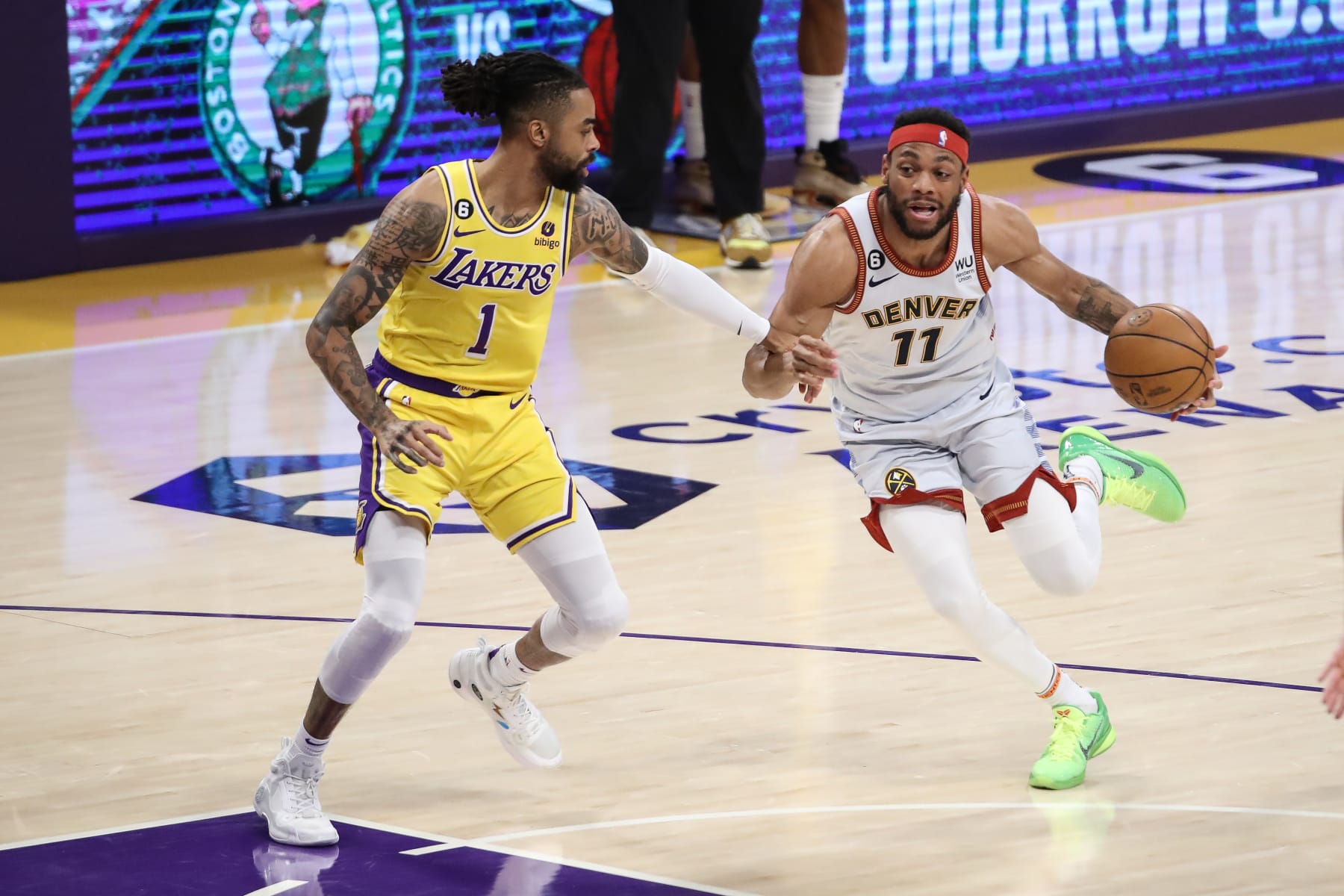 LOS ANGELES, CA - MAY 22: Denver Nuggets forward Bruce Brown (11) drives on Los Angeles Lakers guard D'Angelo Russell (1) during the Denver Nuggets versus the Los Angeles Lakers in Game 4 of the NBA Western Conference Finals on May 22, 2023, at Crypto.com Arena in Los Angeles, CA. (Photo by Jevone Moore/Icon Sportswire via Getty Images)