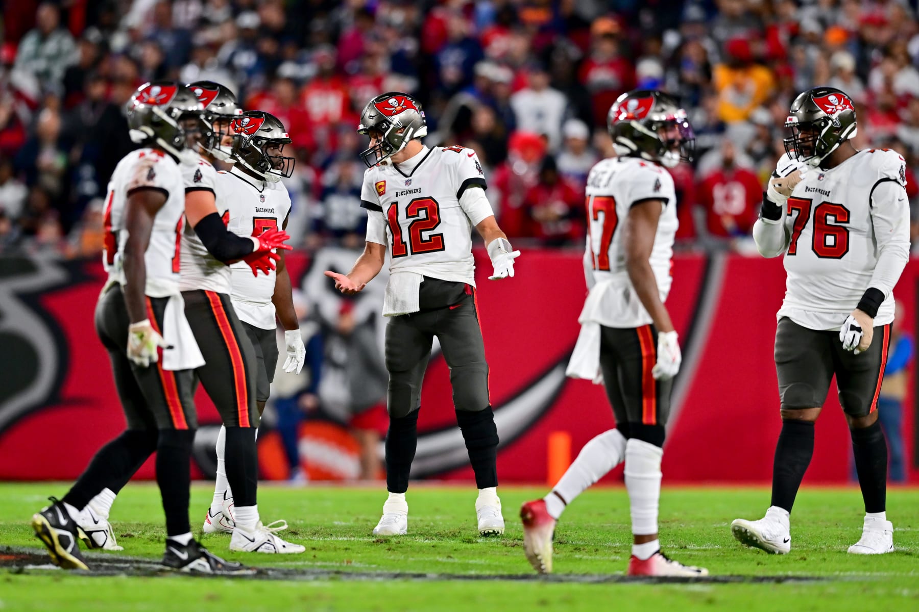 TAMPA, FLORIDA - JANUARY 16: Tom Brady #12 of the Tampa Bay Buccaneers reacts on the field against the Dallas Cowboys during the second quarter in the NFC Wild Card playoff game at Raymond James Stadium on January 16, 2023 in Tampa, Florida. (Photo by Julio Aguilar/Getty Images)