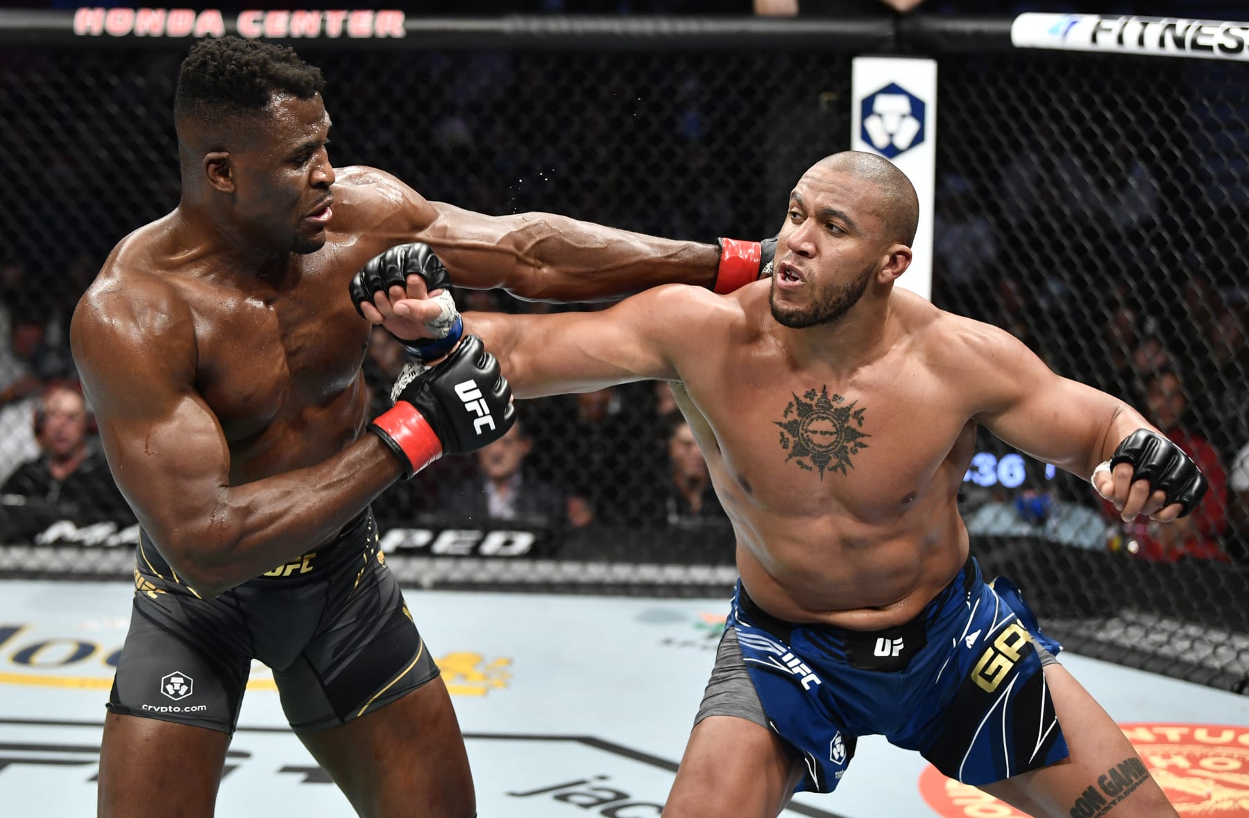 ANAHEIM, CALIFORNIA - JANUARY 22: (L-R) Francis Ngannou of Cameroon and Ciryl Gane of France trade punches in their UFC heavyweight championship fight during the UFC 270 event at Honda Center on January 22, 2022 in Anaheim, California. (Photo by Chris Unger/Zuffa LLC)
