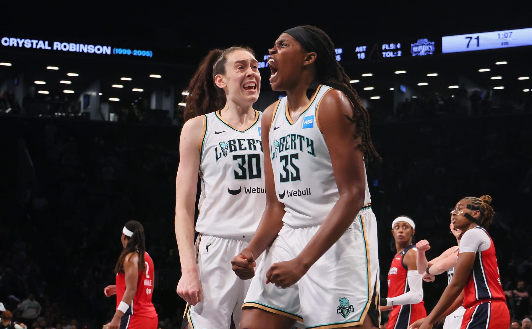 NEW YORK, NEW YORK - SEPTEMBER 19: Breanna Stewart #30 and Jonquel Jones #35 of the New York Liberty celebrate a block against the Washington Mystics during Game Two of Round One of the 2023 Playoffs at the Barclays Center on September 19, 2023 in the Brooklyn borough of New York City. NOTE TO USER: User expressly acknowledges and agrees that, by downloading and or using this photograph, User is consenting to the terms and conditions of the Getty Images License Agreement.  The Liberty defeated the Mystics 90-85 in overtime. (Photo by Bruce Bennett/Getty Images)
