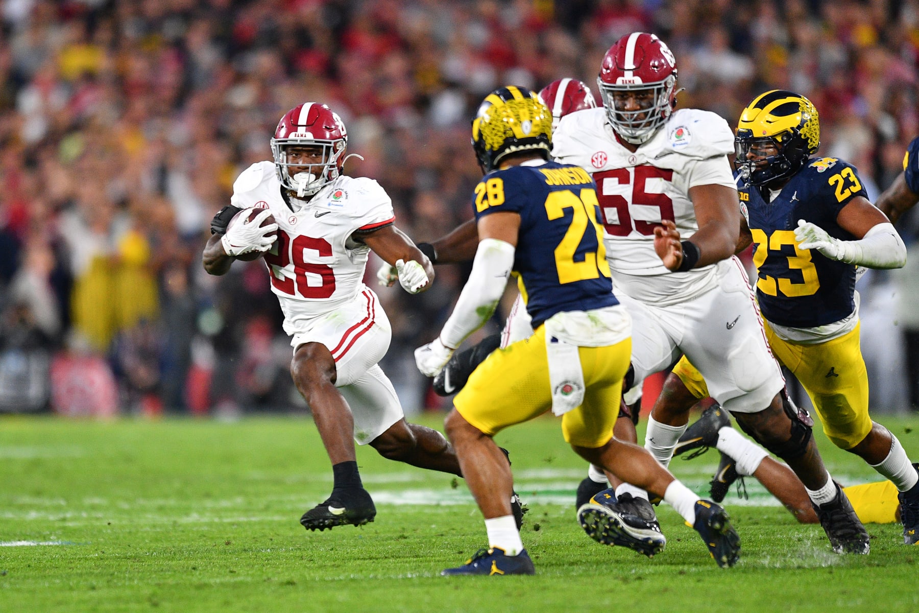 PASADENA, CA - JANUARY 01: OL JC Latham (65) of the Alabama Crimson Tide blocks for RB Jam Miller (26) of the Alabama Crimson Tide during the Alabama Crimson Tide game versus the Michigan Wolverines CFP Semifinal at the Rose Bowl Game on January, 1, 2024, at the Rose Bowl Stadium in Pasadena, CA. (Photo by Brian Rothmuller/Icon Sportswire via Getty Images)