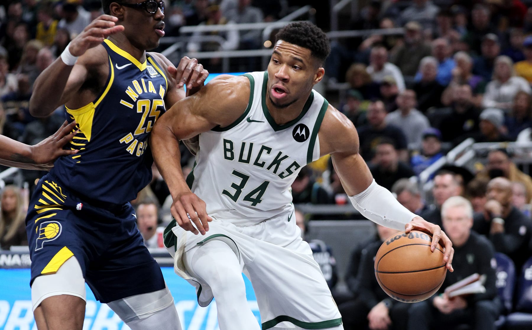 INDIANAPOLIS, INDIANA - JANUARY 03: Giannis Antetokounmpo #34 of the Milwaukee Bucks dribbles the ball against the Indiana Pacers battle for a rebound at Gainbridge Fieldhouse on January 03, 2024 in Indianapolis, Indiana.    NOTE TO USER: User expressly acknowledges and agrees that, by downloading and or using this photograph, User is consenting to the terms and conditions of the Getty Images License Agreement.  (Photo by Andy Lyons/Getty Images)