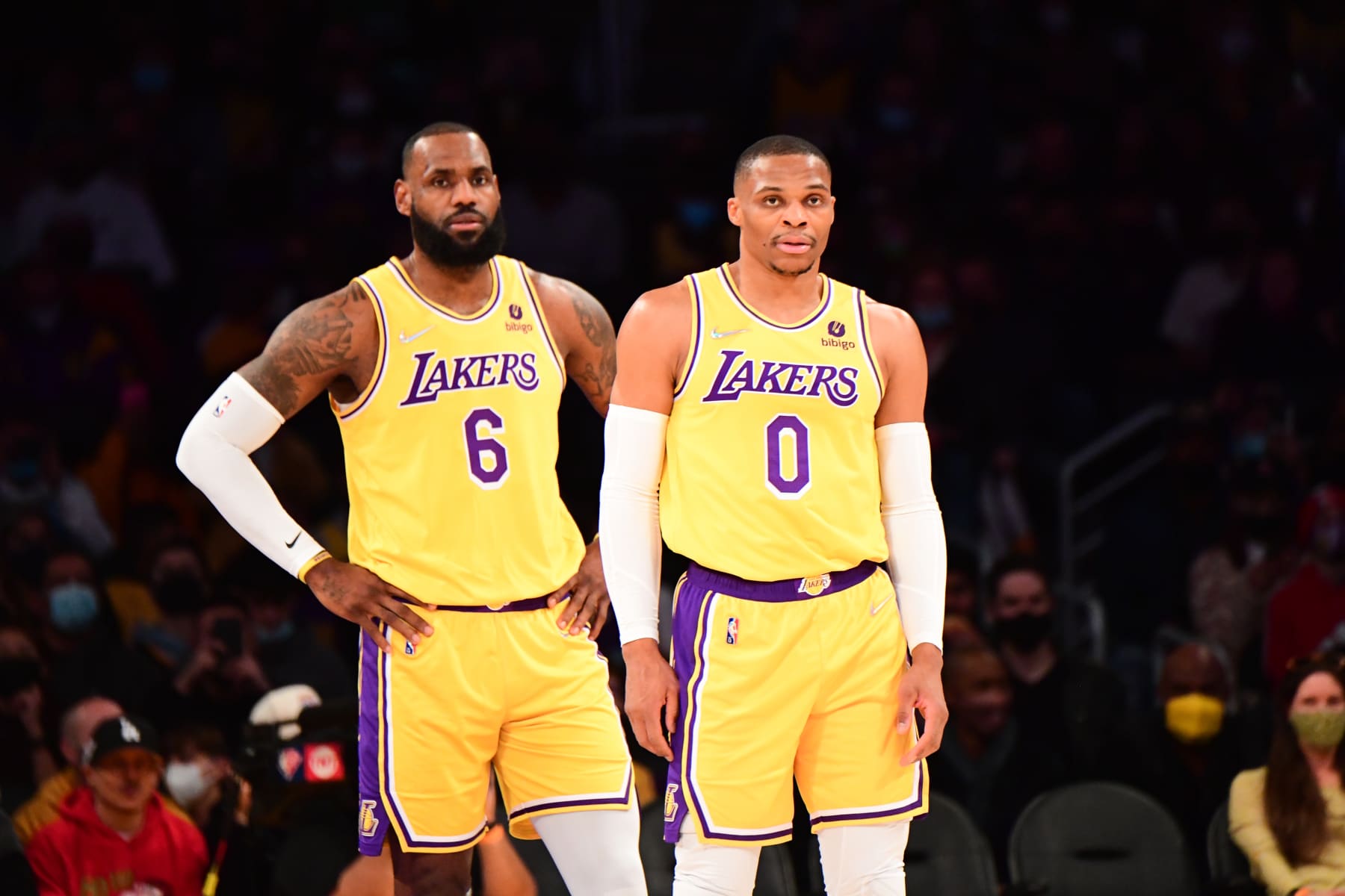 LOS ANGELES, CA - DECEMBER 21: LeBron James #6 of the Los Angeles Lakers and Russell Westbrook #0 of the Los Angeles Lakers look on during the game against the Phoenix Suns on December 21, 2021 at STAPLES Center in Los Angeles, California. NOTE TO USER: User expressly acknowledges and agrees that, by downloading and/or using this Photograph, user is consenting to the terms and conditions of the Getty Images License Agreement. Mandatory Copyright Notice: Copyright 2021 NBAE (Photo by Adam Pantozzi/NBAE via Getty Images)