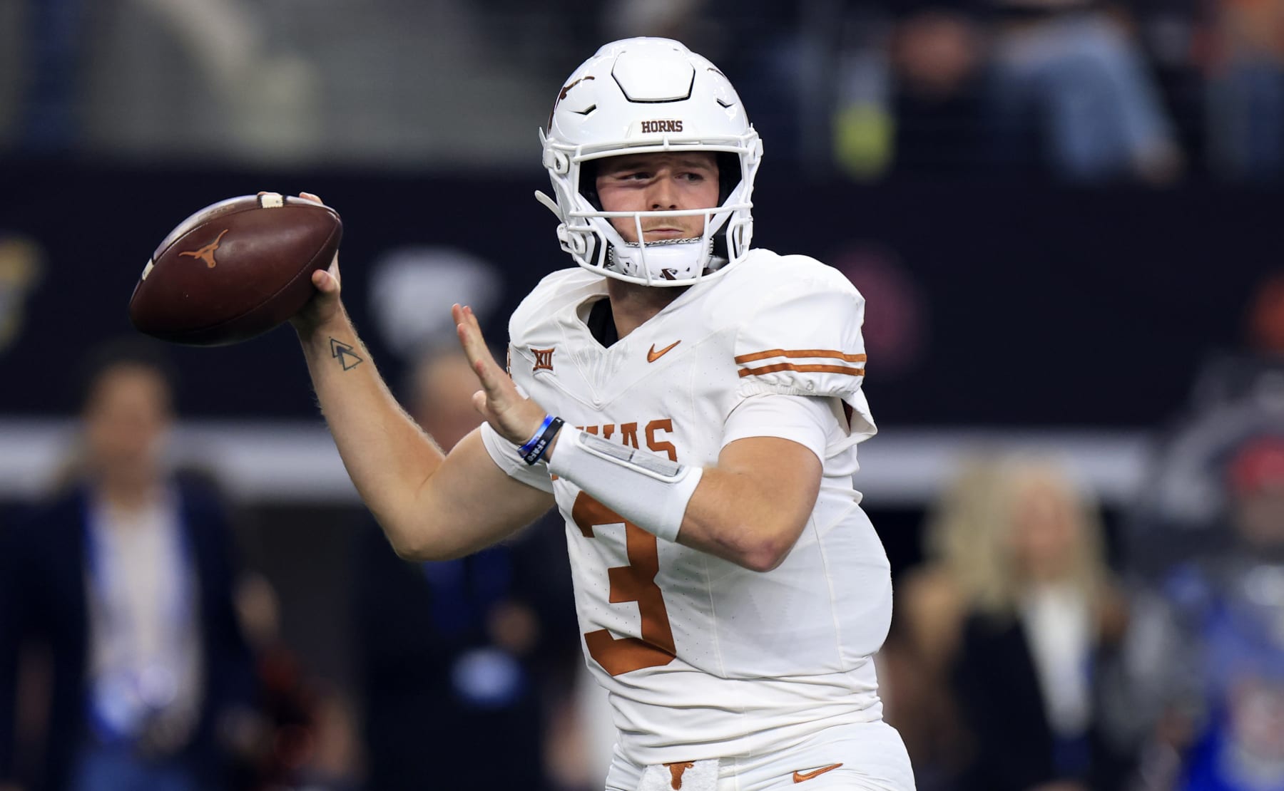 ARLINGTON, TX - DECEMBER 2: Quarterback Quinn Ewers #3 of the Texas Longhorns throws down field against the Oklahoma State Cowboys in the first half of the Big 12  Championship at AT&T Stadium on December 2, 2023 in Arlington, Texas.  (Photo by Ron Jenkins/Getty Images)