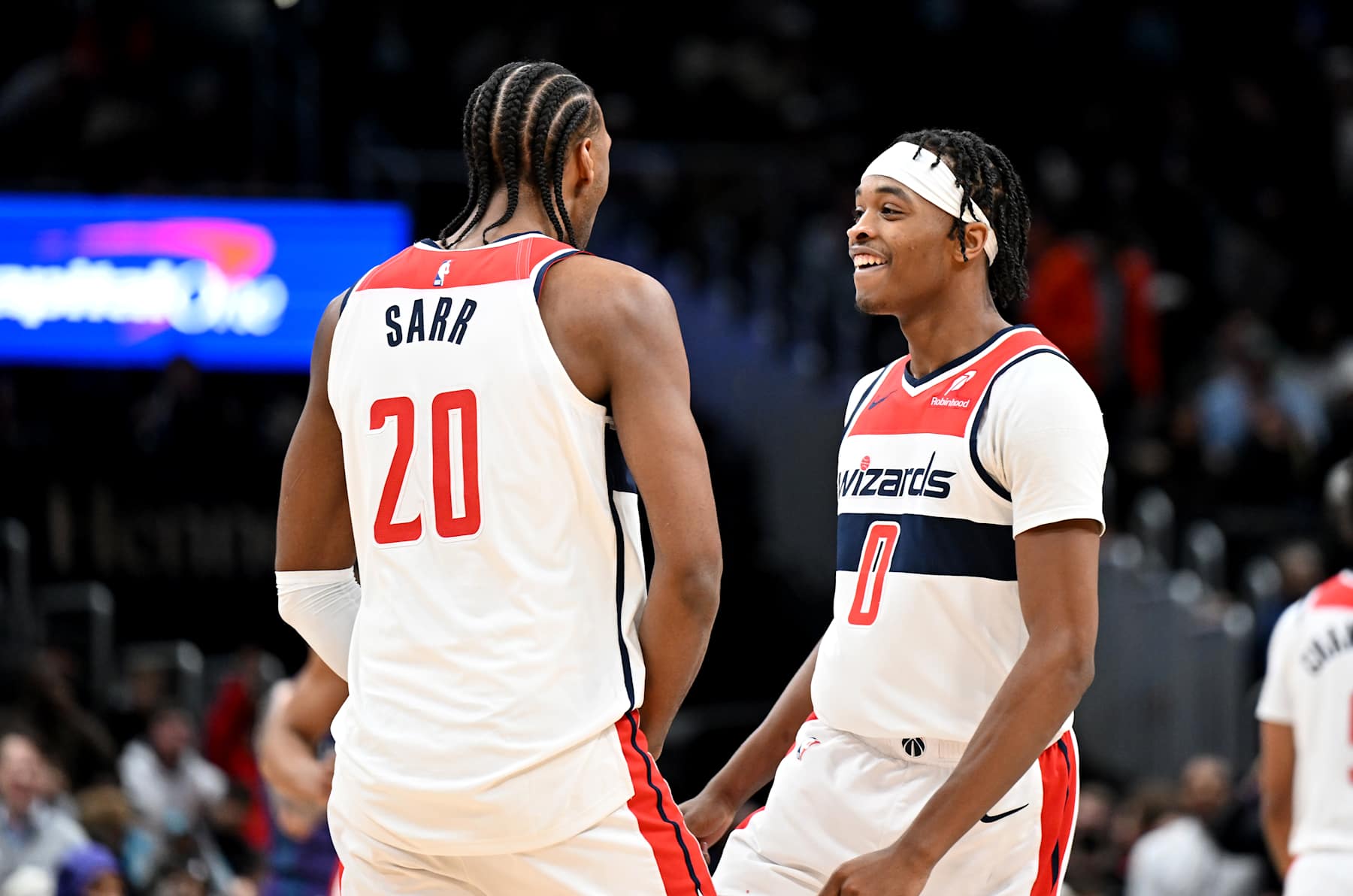 WASHINGTON, DC - DECEMBER 19: Bilal Coulibaly #0 and Alexandre Sarr #20 of the Washington Wizards celebrate during the game against the Charlotte Hornets at Capital One Arena on December 19, 2024 in Washington, DC. NOTE TO USER: User expressly acknowledges and agrees that, by downloading and or using this photograph, User is consenting to the terms and conditions of the Getty Images License Agreement.  (Photo by G Fiume/Getty Images)