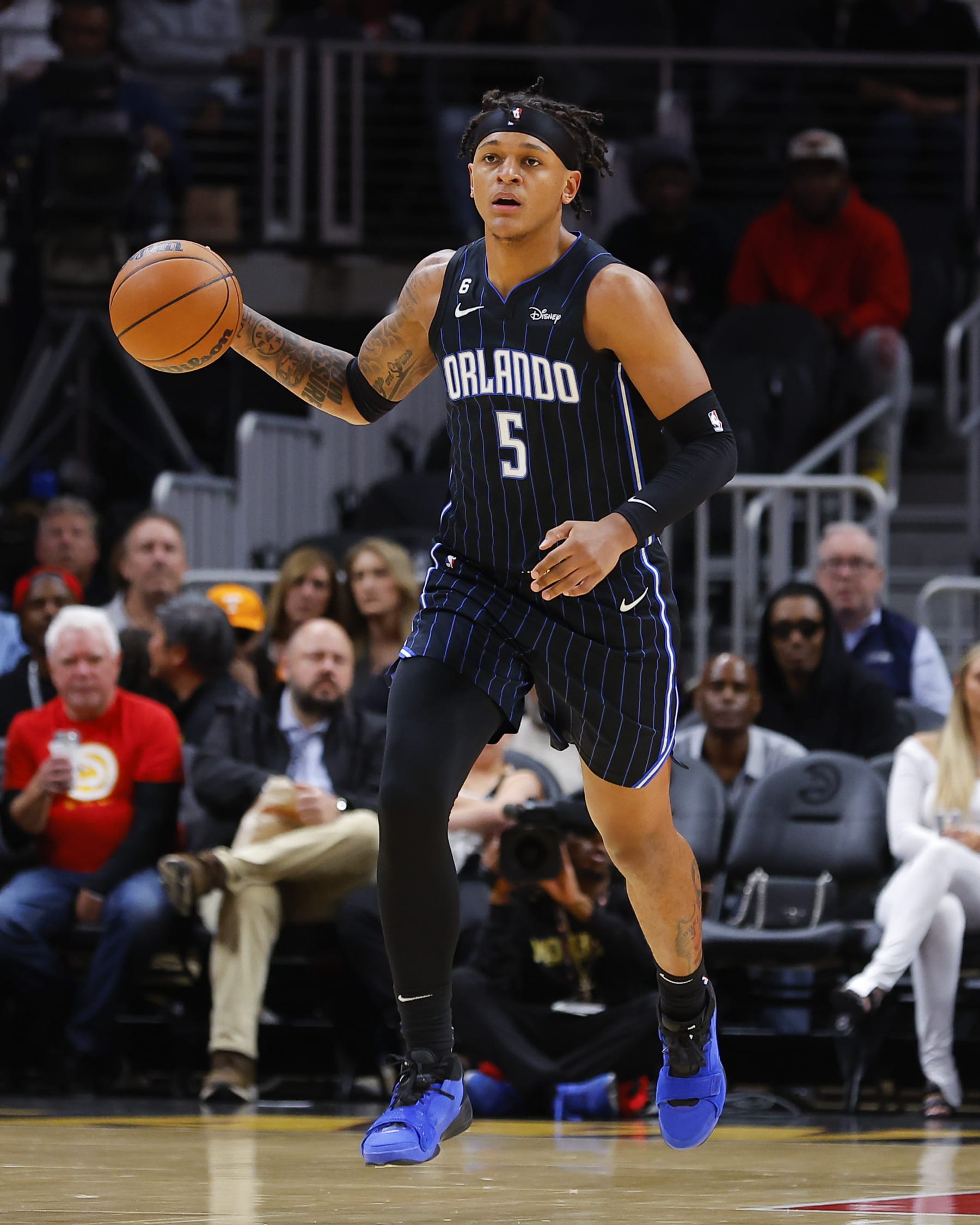 ATLANTA, GA - OCTOBER 21: Paolo Banchero #5 of the Orlando Magic dribbles down court during the first half against the Atlanta Hawks at State Farm Arena on October 21, 2022 in Atlanta, Georgia. NOTE TO USER: User expressly acknowledges and agrees that, by downloading and or using this photograph, User is consenting to the terms and conditions of the Getty Images License Agreement. (Photo by Todd Kirkland/Getty Images)