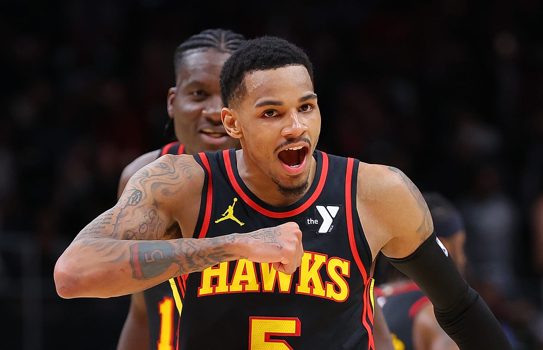 ATLANTA, GEORGIA - MARCH 28:  Dejounte Murray #5 of the Atlanta Hawks reacts after hitting the game-winning basket during overtime against the Boston Celtics at State Farm Arena on March 28, 2024 in Atlanta, Georgia.  NOTE TO USER: User expressly acknowledges and agrees that, by downloading and/or using this photograph, user is consenting to the terms and conditions of the Getty Images License Agreement.  (Photo by Kevin C. Cox/Getty Images)
