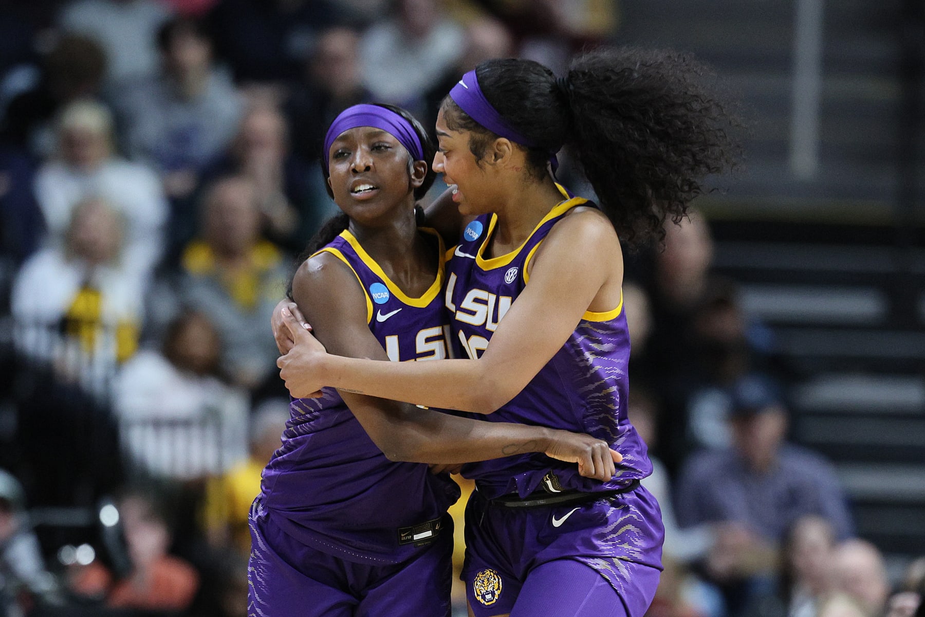 ALBANY, NEW YORK - MARCH 30: Angel Reese #10 of the LSU Tigers and Flau'jae Johnson #4 of the LSU Tigers celebrate in a game against the UCLA Bruins during the second half in the Sweet 16 round of the NCAA Women's Basketball Tournament at MVP Arena on March 30, 2024 in Albany, New York. (Photo by Andy Lyons/Getty Images)