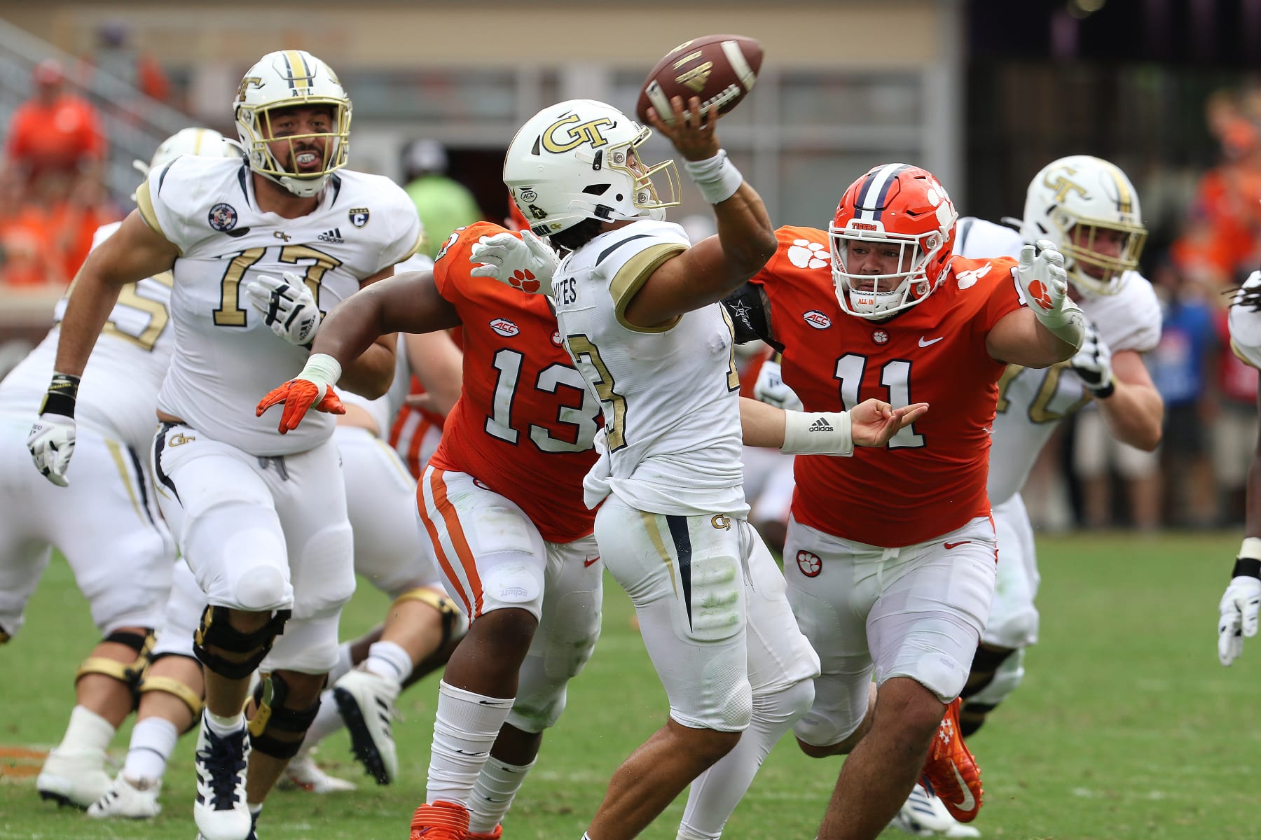 CLEMSON, SC - SEPTEMBER 18: Jordan Yates (13) quarterback of Georgia Tech is pressured by Bryan Bresee (11) defensive lineman of Clemson during a college football game between the Georgia State Yellow Jackets and the Clemson Tigers on September 18, 2021, at Clemson Memorial Stadium in Clemson, S.C. (Photo by John Byrum/Icon Sportswire via Getty Images)