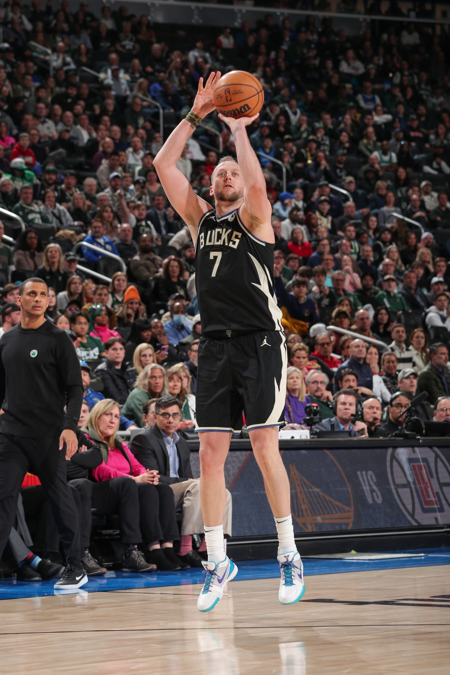 MILWAUKEE, WI - FEBUARY 14:  Joe Ingles #7 of the Milwaukee Bucks shoots a three point basket during the game  on Febuary 14, 2023 at the Fiserv Forum Center in Milwaukee, Wisconsin. NOTE TO USER: User expressly acknowledges and agrees that, by downloading and or using this Photograph, user is consenting to the terms and conditions of the Getty Images License Agreement. Mandatory Copyright Notice: Copyright 2023 NBAE (Photo by Gary Dineen/NBAE via Getty Images).