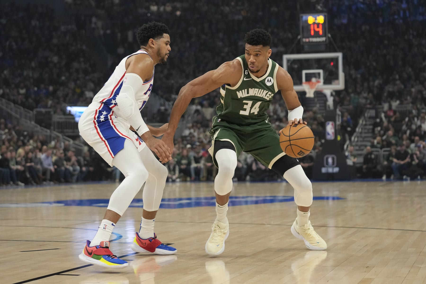 MILWAUKEE, WISCONSIN - MARCH 04: Giannis Antetokounmpo #34 of the Milwaukee Bucks dribbles the ball against Tobias Harris #12 of the Philadelphia 76ers in the first half at Fiserv Forum on March 04, 2023 in Milwaukee, Wisconsin. NOTE TO USER: User expressly acknowledges and agrees that, by downloading and or using this photograph, user is consenting to the terms and conditions of the Getty Images License Agreement. (Photo by Patrick McDermott/Getty Images)