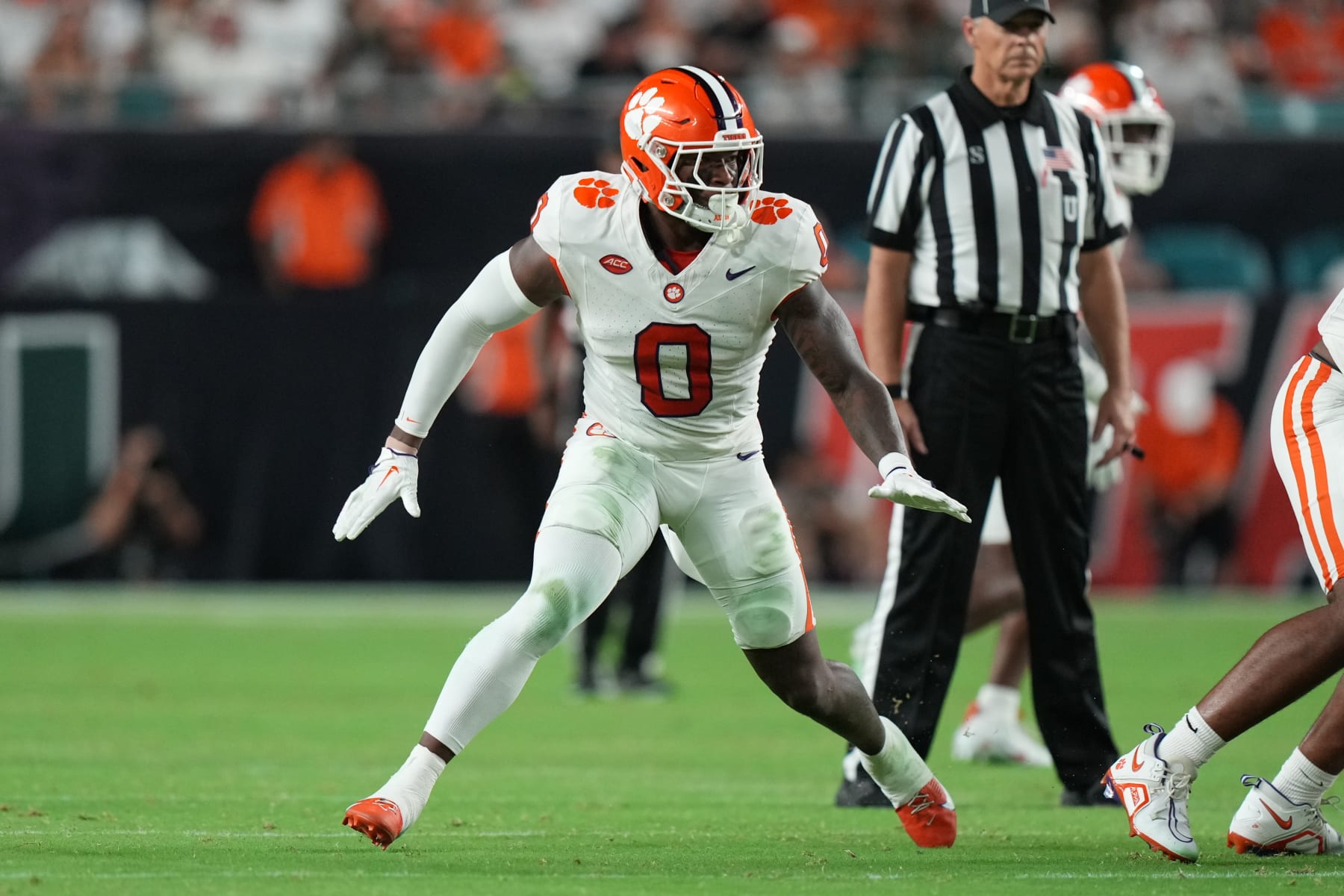 MIAMI GARDENS, FL - OCTOBER 21: Clemson Tigers linebacker Barrett Carter (0) rushes the passer during the game between the Clemson Tigers and the Miami Hurricanes on Saturday, October 21, 2023 at Hard Rock Stadium, Miami Gardens, Fla. (Photo by Peter Joneleit/Icon Sportswire via Getty Images)