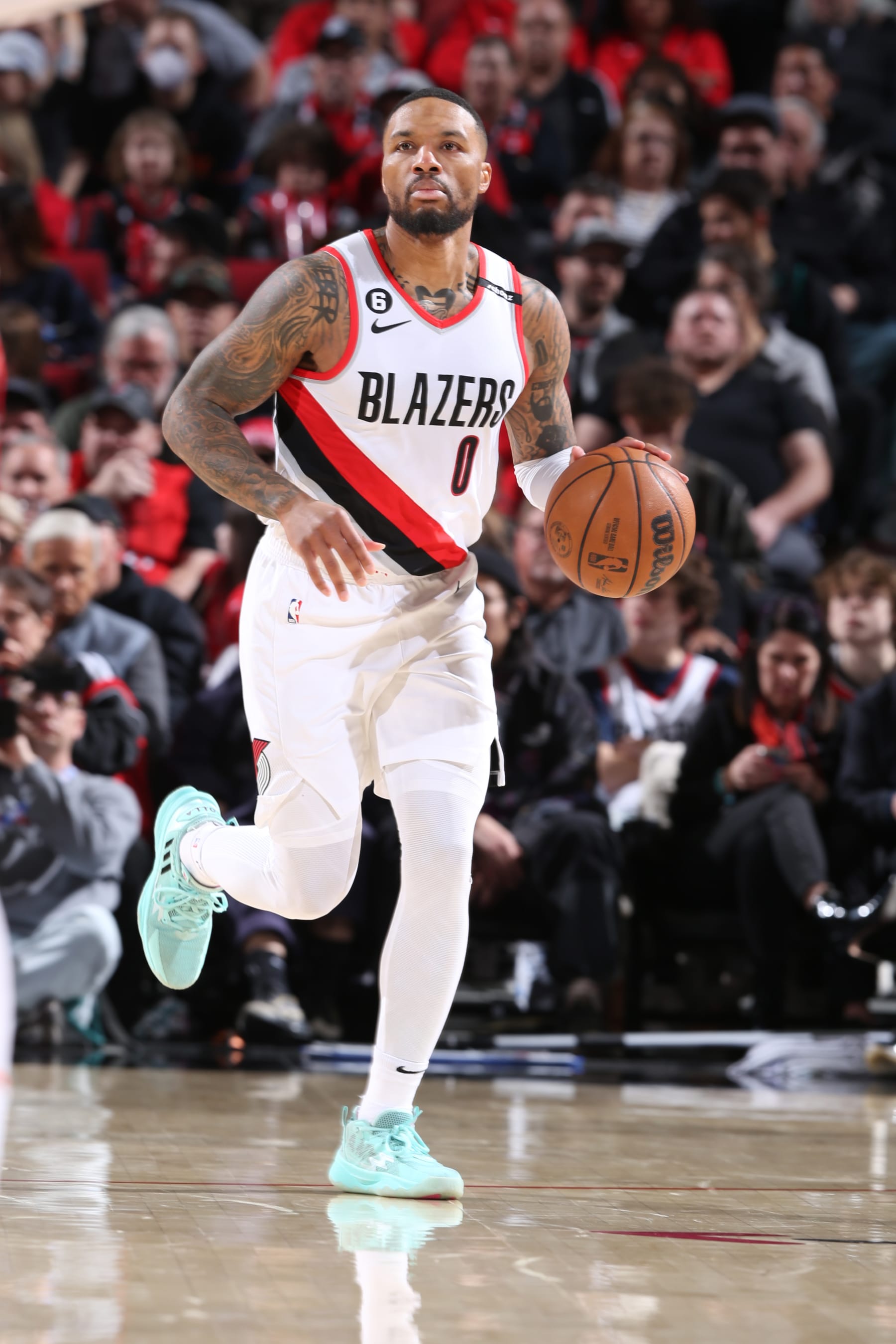 PORTLAND, OR - MARCH 14:  Damian Lillard #0 of the Portland Trail Blazers goes to the basket during the game on March 14, 2023 at the Moda Center Arena in Portland, Oregon. NOTE TO USER: User expressly acknowledges and agrees that, by downloading and or using this photograph, user is consenting to the terms and conditions of the Getty Images License Agreement. Mandatory Copyright Notice: Copyright 2023 NBAE (Photo by Sam Forencich/NBAE via Getty Images)
