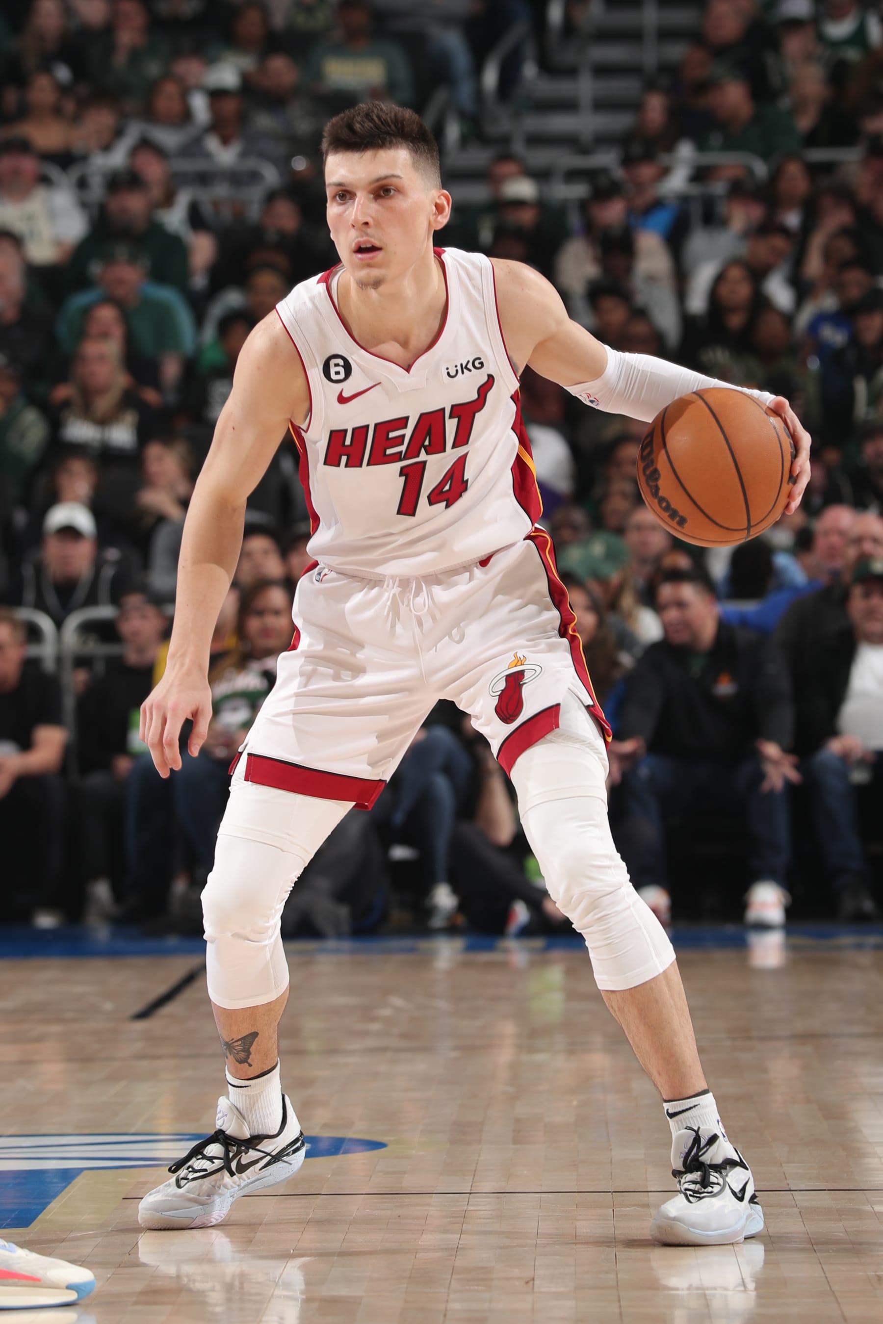 MILWAUKEE, WI - APRIL 16: Tyler Herro #14 of the Miami Heat dribbles the ball during the game against the Milwaukee Bucks during Round One Game One of the 2023 NBA Playoffs on April 16, 2023 at the Fiserv Forum Center in Milwaukee, Wisconsin. NOTE TO USER: User expressly acknowledges and agrees that, by downloading and or using this Photograph, user is consenting to the terms and conditions of the Getty Images License Agreement. Mandatory Copyright Notice: Copyright 2023 NBAE (Photo by Gary Dineen/NBAE via Getty Images).