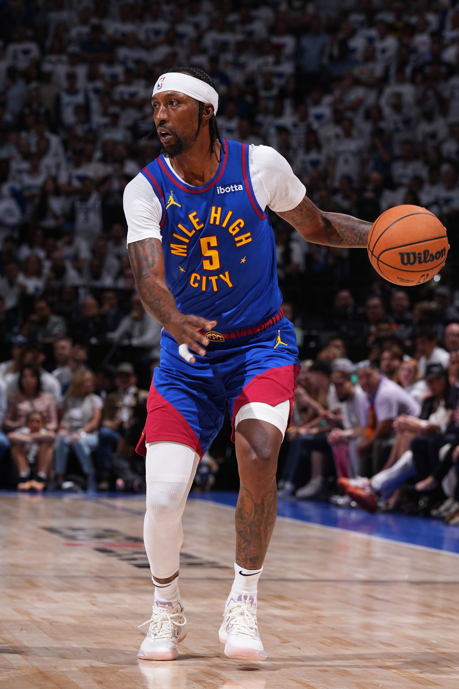 MINNEAPOLIS, MN - MAY 16: Kentavious Caldwell-Pope #5 of the Denver Nuggets dribbles the ball during the game against the Minnesota Timberwolves during Round 2 Game 6 of the 2024 NBA Playoffs on May 16, 2024 at Target Center in Minneapolis, Minnesota. NOTE TO USER: User expressly acknowledges and agrees that, by downloading and or using this Photograph, user is consenting to the terms and conditions of the Getty Images License Agreement. Mandatory Copyright Notice: Copyright 2024 NBAE (Photo by Garrett Ellwood/NBAE via Getty Images)