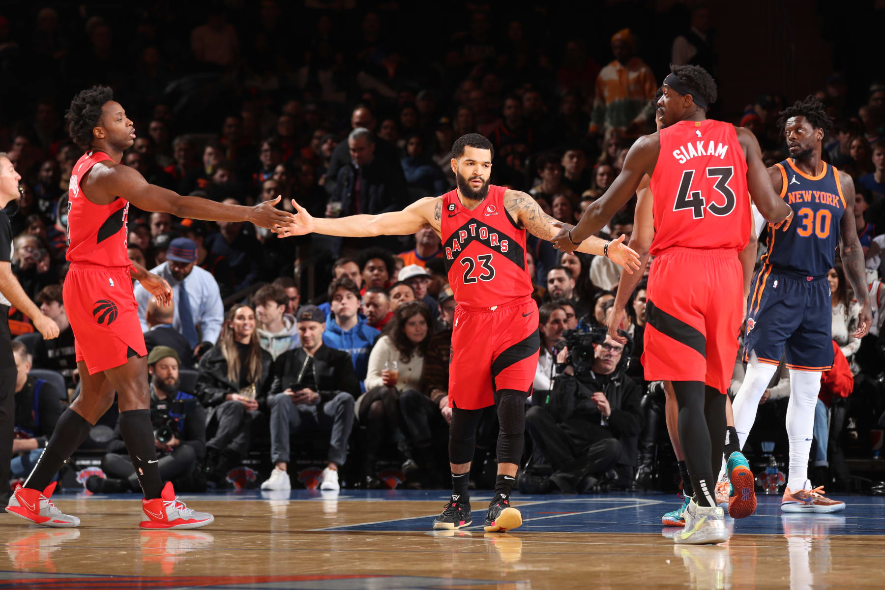 NEW YORK, NY - DECEMBER 21: Fred VanVleet #23 of the Toronto Raptors high fives teammates OG Anunoby #3 and Pascal Siakam #43 during the game against the New York Knicks on December 21, 2022 at Madison Square Garden in New York City, New York. NOTE TO USER: User expressly acknowledges and agrees that, by downloading and or using this photograph, User is consenting to the terms and conditions of the Getty Images License Agreement. Mandatory Copyright Notice: Copyright 2022 NBAE (Photo by Joe Murphy/NBAE via Getty Images)