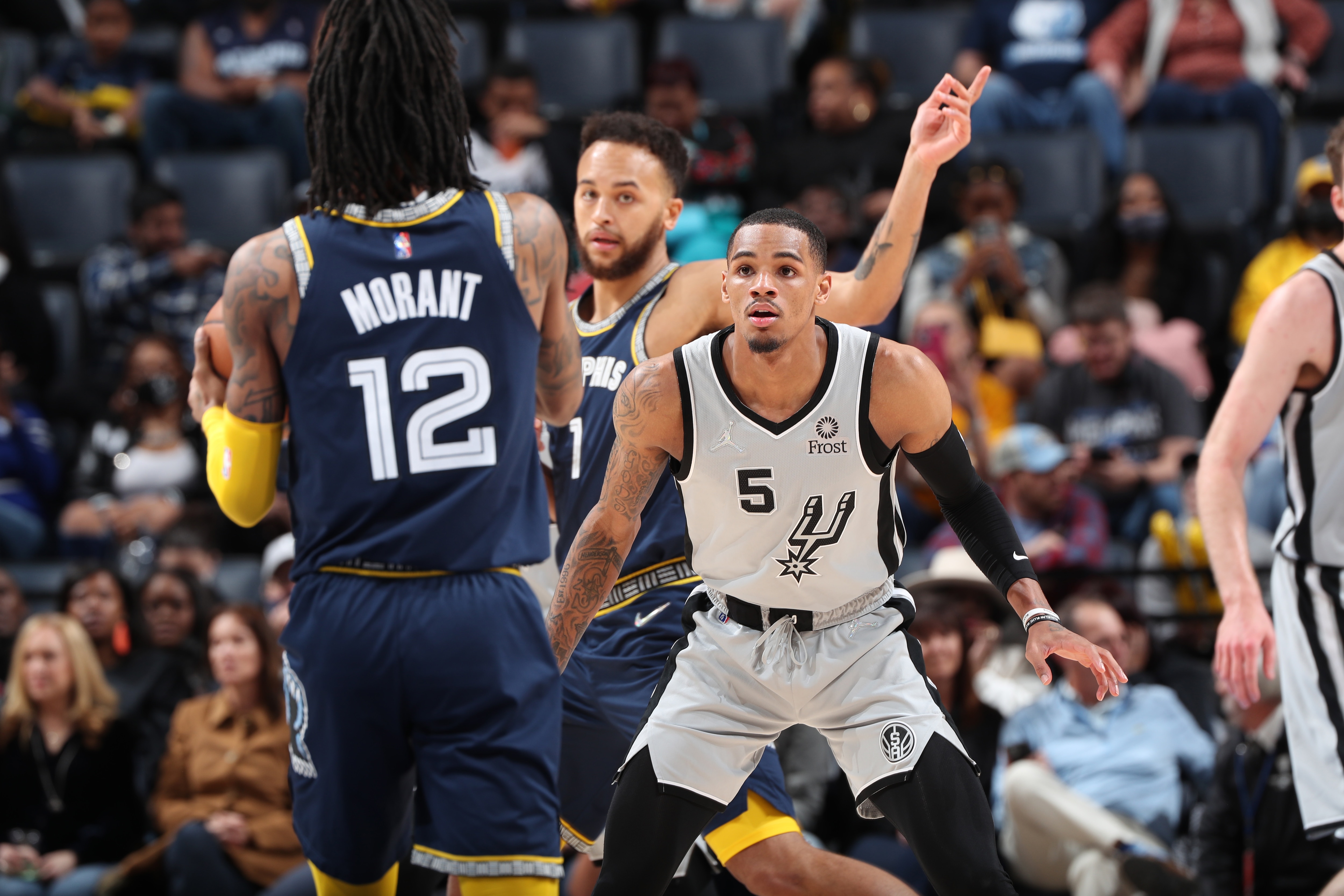 MEMPHIS, TN - FEBRUARY 28: Dejounte Murray #5 of the San Antonio Spurs plays defense on Ja Morant #12 of the Memphis Grizzlies during the game on February 28, 2022 at FedExForum in Memphis, Tennessee. NOTE TO USER: User expressly acknowledges and agrees that, by downloading and or using this photograph, User is consenting to the terms and conditions of the Getty Images License Agreement. Mandatory Copyright Notice: Copyright 2022 NBAE (Photo by Joe Murphy/NBAE via Getty Images)