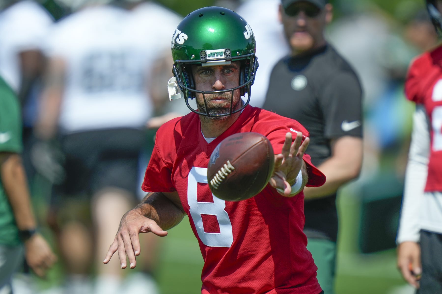 New York Jets quarterback Aaron Rodgers participates in a drill at the NFL football team's training facility in Florham Park, N.J., Sunday, July 23, 2023. (AP Photo/Seth Wenig) New York Jets quarterback Aaron Rodgers participates in a drill at the NFL football team's training facility in Florham Park, N.J., Sunday, July 23, 2023. (AP Photo/Seth Wenig)