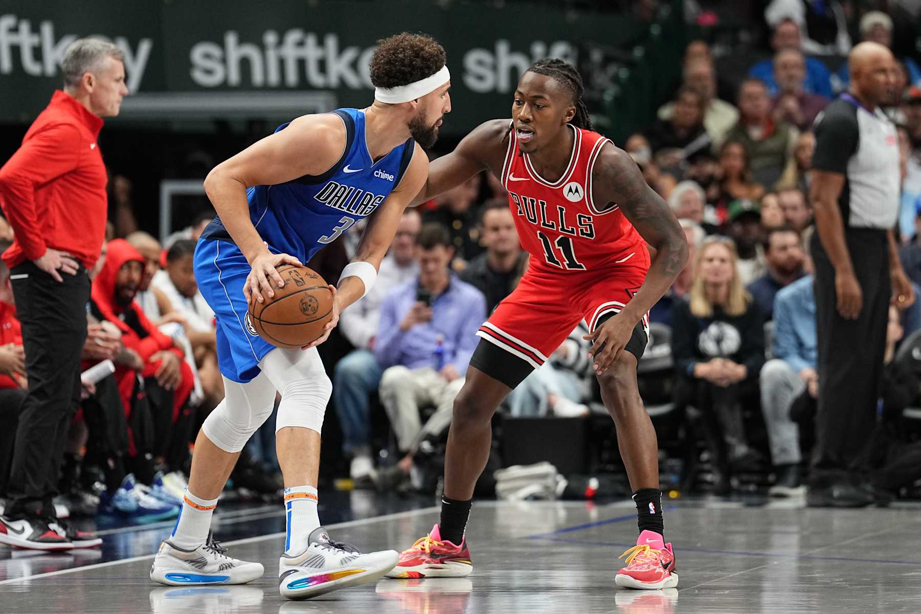DALLAS, TX - NOVEMBER 6: Ayo Dosunmu #11 of the Chicago Bulls defends drives to the basket during the game against the Dallas Mavericks on November 6, 2024 at American Airlines Center in Dallas, Texas. NOTE TO USER: User expressly acknowledges and agrees that, by downloading and or using this photograph, User is consenting to the terms and conditions of the Getty Images License Agreement. Mandatory Copyright Notice: Copyright 2024 NBAE (Photo by Glenn James/NBAE via Getty Images)