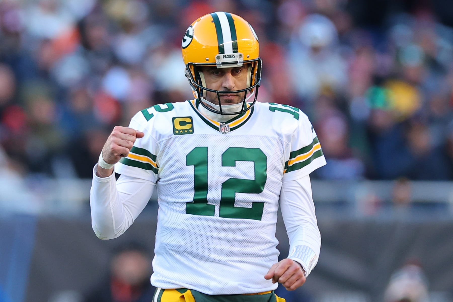 CHICAGO, ILLINOIS - DECEMBER 04: Aaron Rodgers #12 of the Green Bay Packers celebrates after a successful two-point conversion against the Chicago Bears during the fourth quarter of the game at Soldier Field on December 04, 2022 in Chicago, Illinois. (Photo by Michael Reaves/Getty Images)