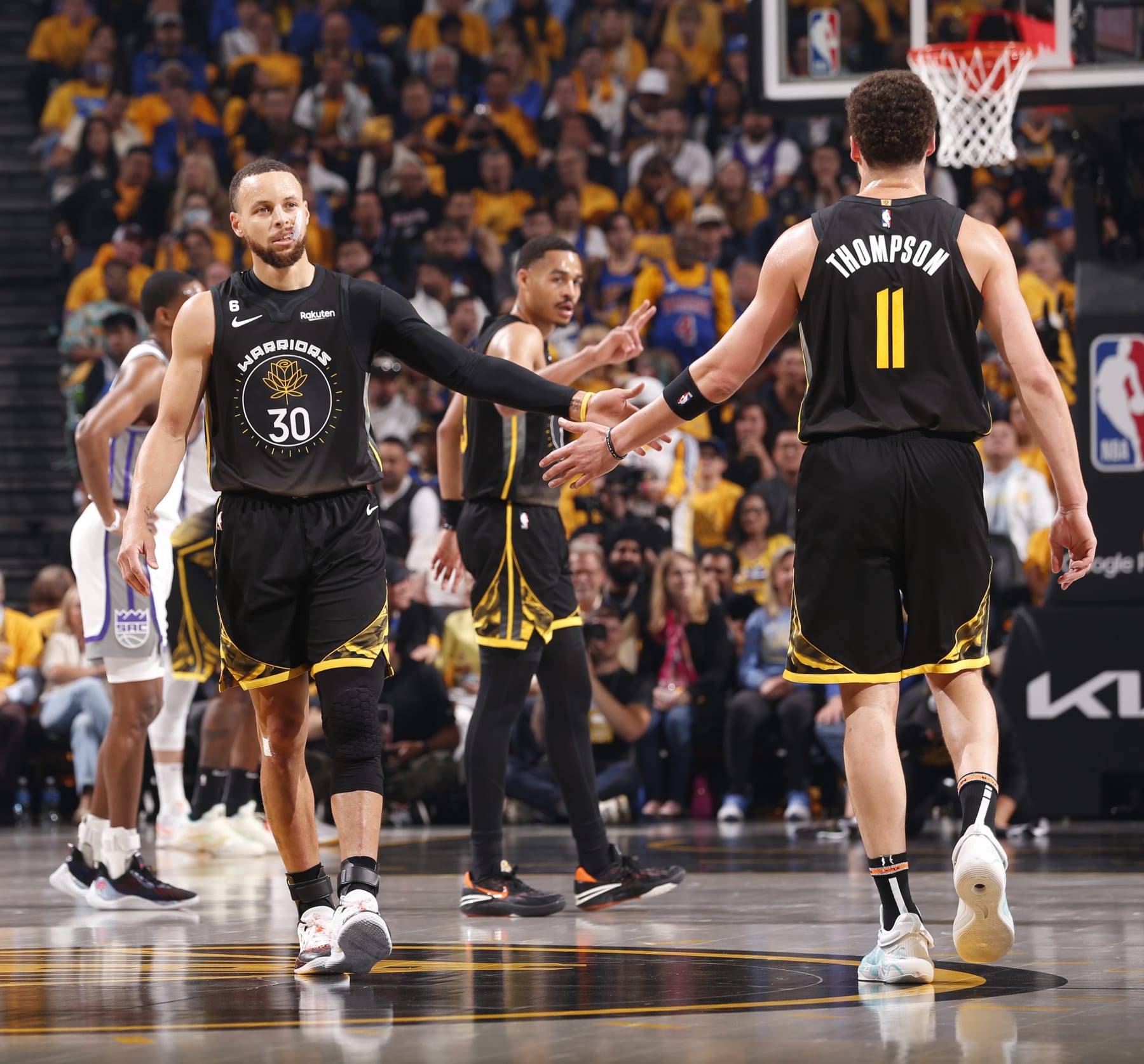 SAN FRANCISCO, CA - APRIL 20:  Stephen Curry #30 & Klay Thompson #11 of the Golden State Warriors high fives during the game during round one game three of the 2023 NBA Playoffs on April 20, 2023 at Chase Center in San Francisco, California. NOTE TO USER: User expressly acknowledges and agrees that, by downloading and or using this photograph, user is consenting to the terms and conditions of Getty Images License Agreement. Mandatory Copyright Notice: Copyright 2023 NBAE (Photo by Jed Jacobsohn/NBAE via Getty Images)
