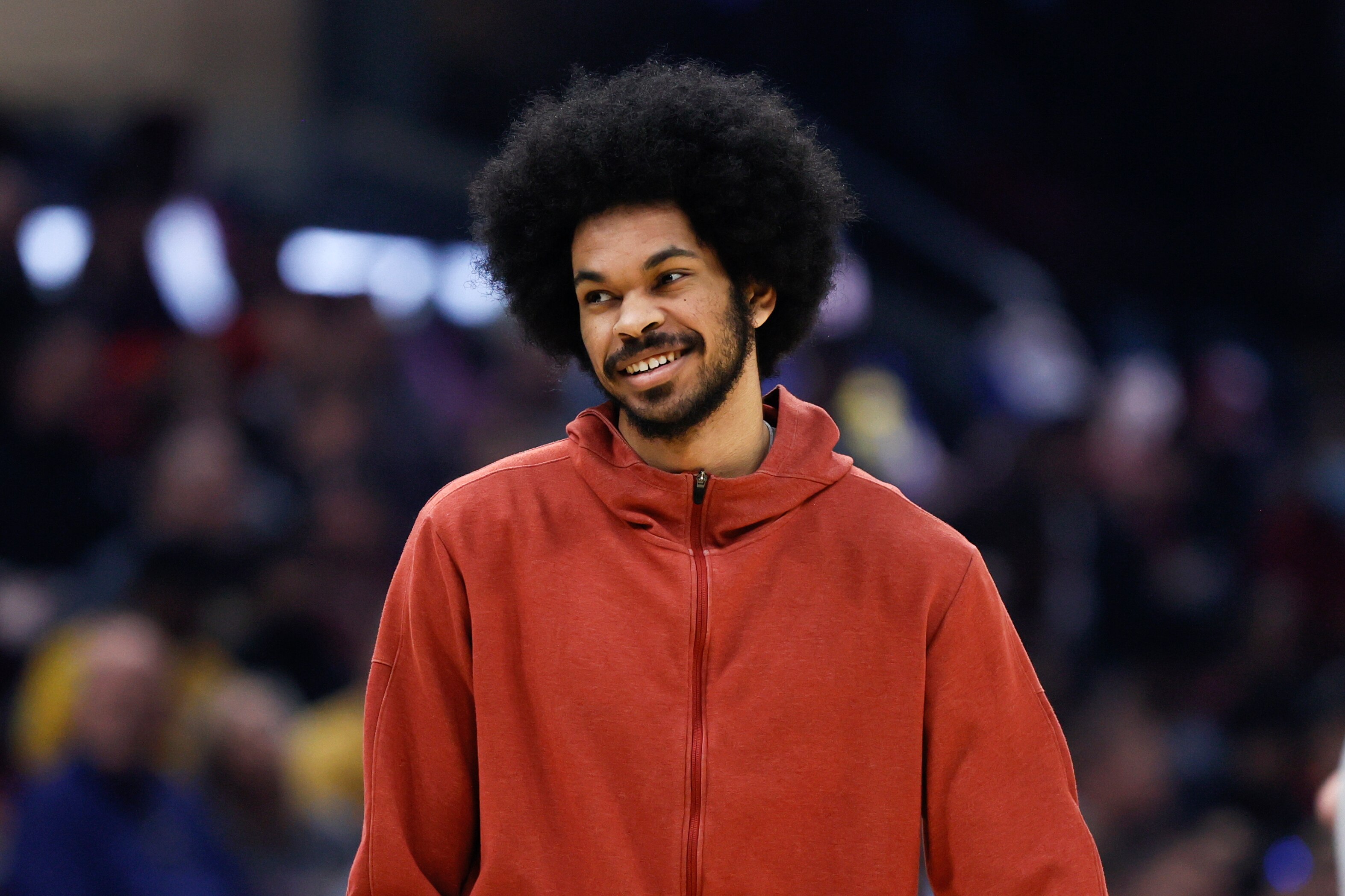 Injured Cleveland Cavaliers center Jarrett Allen watches from the sideline during the first half of the team's NBA basketball game against the Dallas Mavericks, Wednesday, March 30, 2022, in Cleveland. (AP Photo/Ron Schwane)