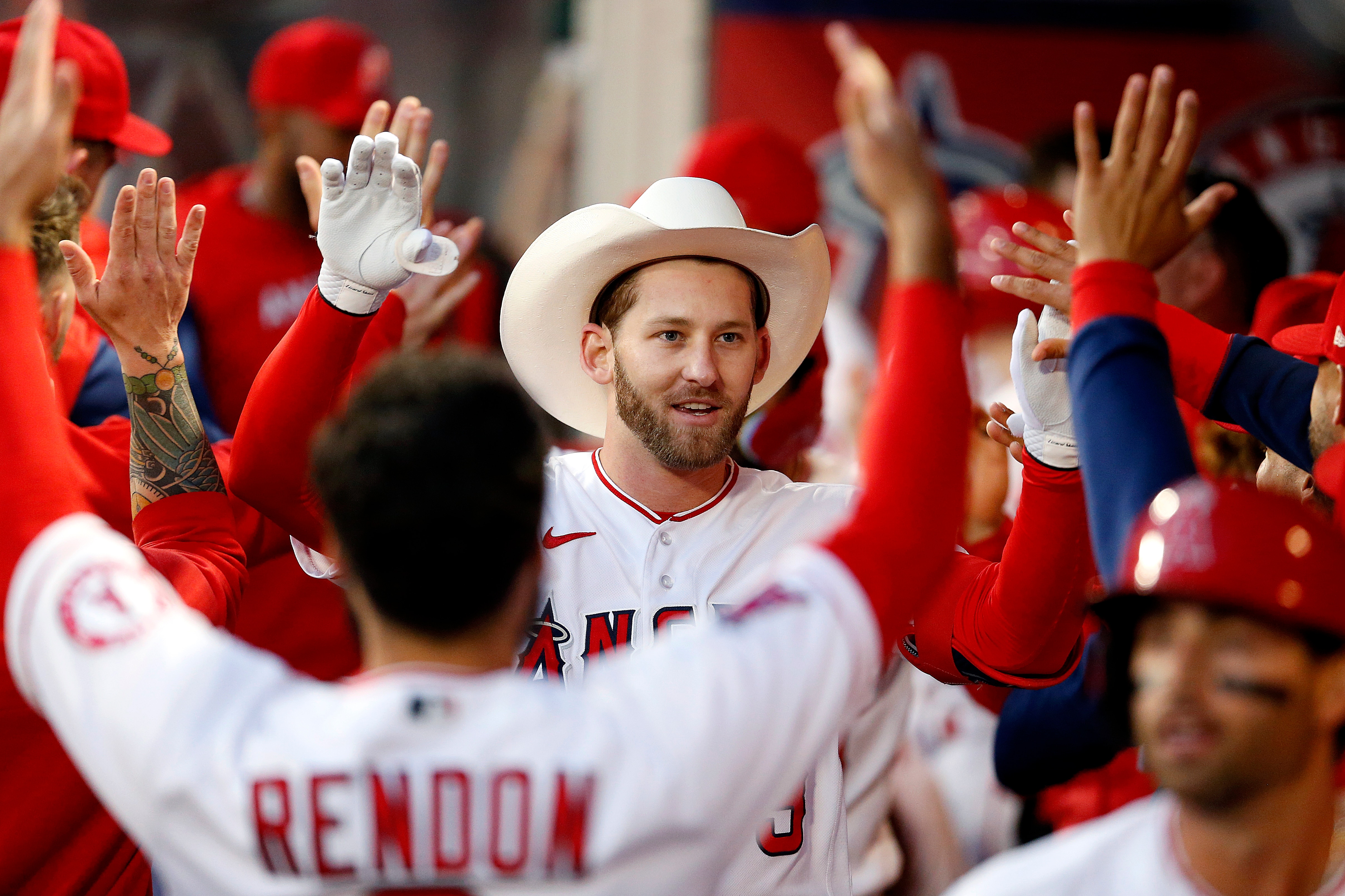 ANAHEIM, CA - APRIL 27: Los Angeles Angels right fielder Taylor Ward (3) is congratulated by teammates after hitting a grand slam home run in the bottom of the second putting the Angels up 6-2 over the Cleveland Guardians at Angel Stadium of Anaheim on Wednesday, April 27, 2022 in Anaheim, CA. (Gary Coronado / Los Angeles Times via Getty Images)