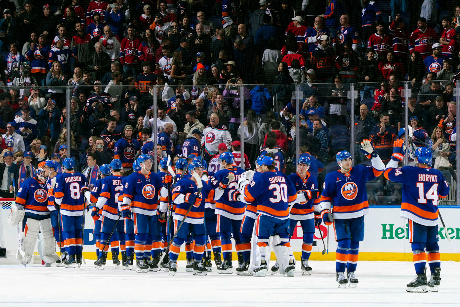 ELMONT, NEW YORK - OCTOBER 19:  The New York Islanders celebrate their 4-3 overtime shootout win \am at UBS Arena on October 19, 2024 in Elmont, New York. (Photo by Mike Stobe/NHLI via Getty Images)