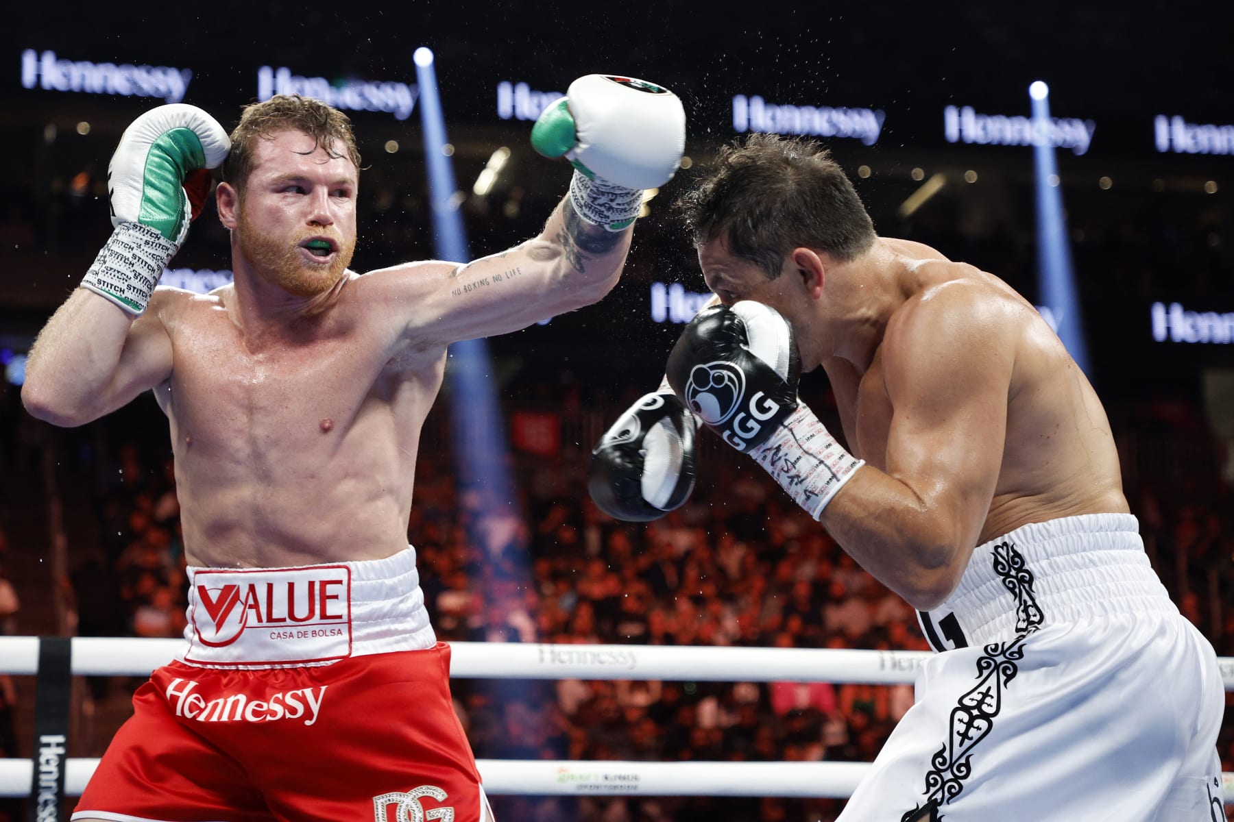 LAS VEGAS, NEVADA - SEPTEMBER 17: Canelo Alvarez (red trunks) misses a punch against Gennadiy Golovkin (white trunks) in round five of the fight for the Super Middleweight Title at T-Mobile Arena on September 17, 2022 in Las Vegas, Nevada. (Photo by Sarah Stier/Getty Images)