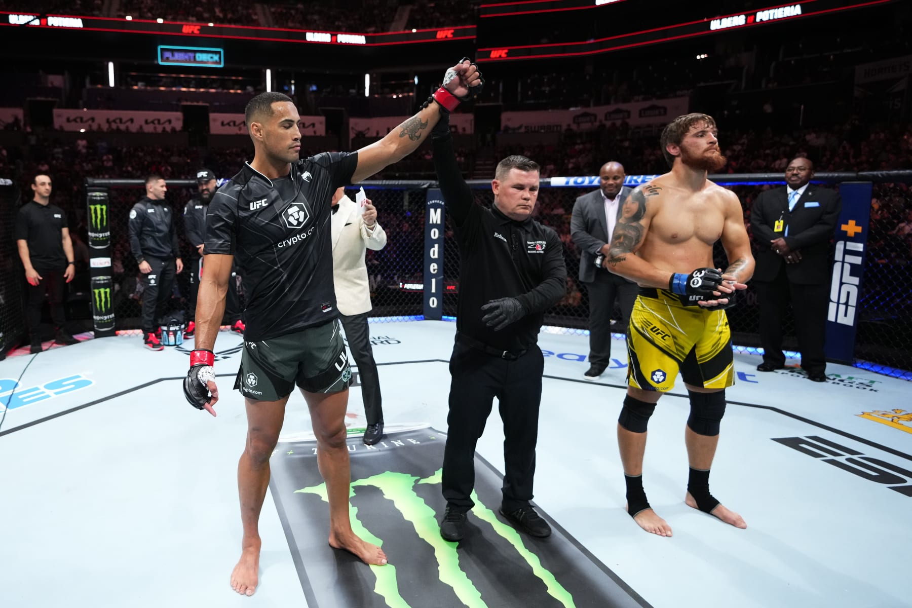 CHARLOTTE, NORTH CAROLINA - MAY 13:  (L-R) Carlos Ulberg of New Zealand reacts after his TKO victory over Ihor Potieria of Ukraine in their light heavyweight fight during the UFC Fight Night event at Spectrum Center on May 13, 2023 in Charlotte, North Carolina. (Photo by Jeff Bottari/Zuffa LLC via Getty Images)