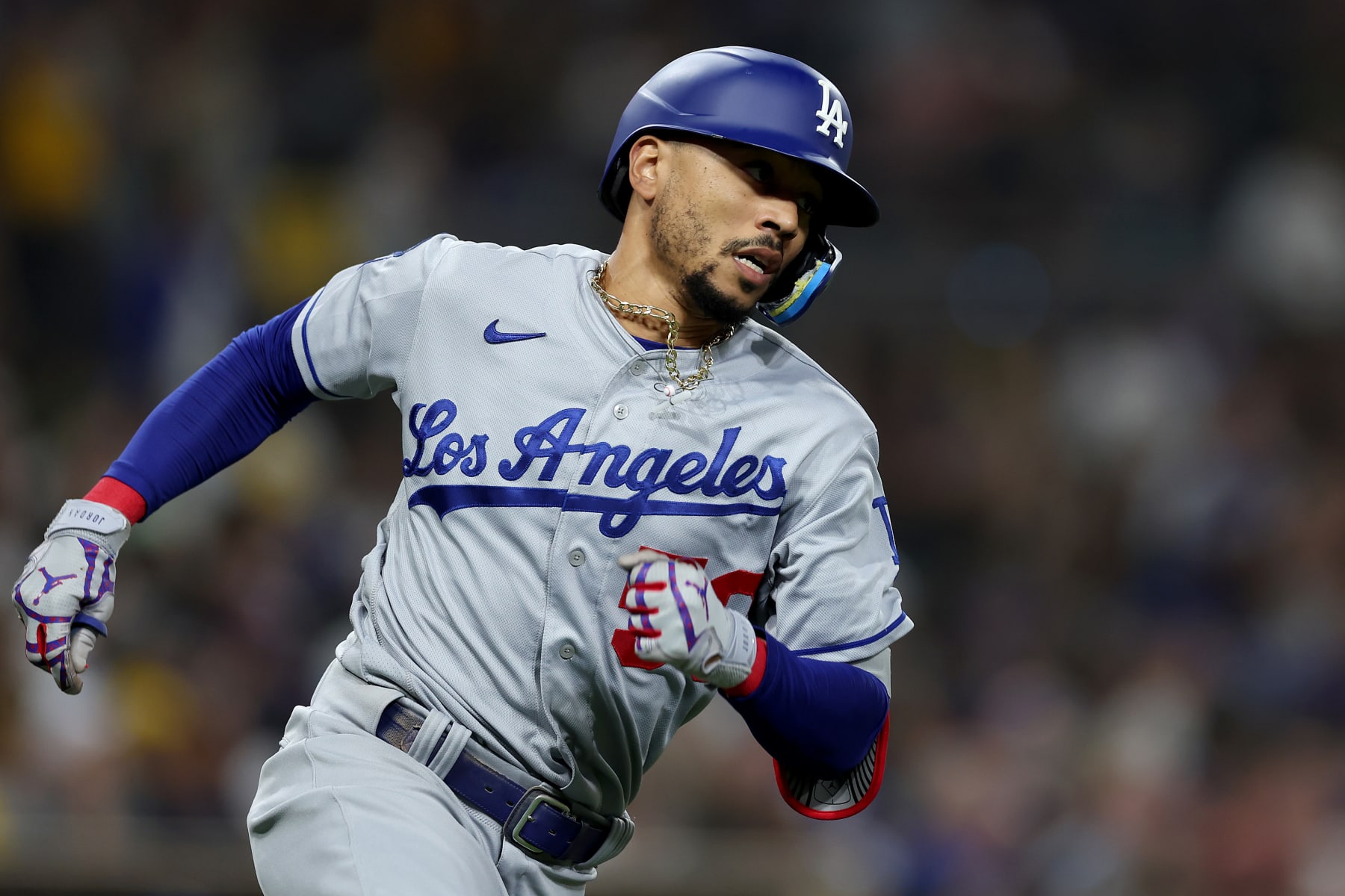 SAN DIEGO, CALIFORNIA - SEPTEMBER 29: Mookie Betts #50 of the Los Angeles Dodgers runs to first base during a game against the Los Angeles Dodgers at PETCO Park on September 29, 2022 in San Diego, California. (Photo by Sean M. Haffey/Getty Images)