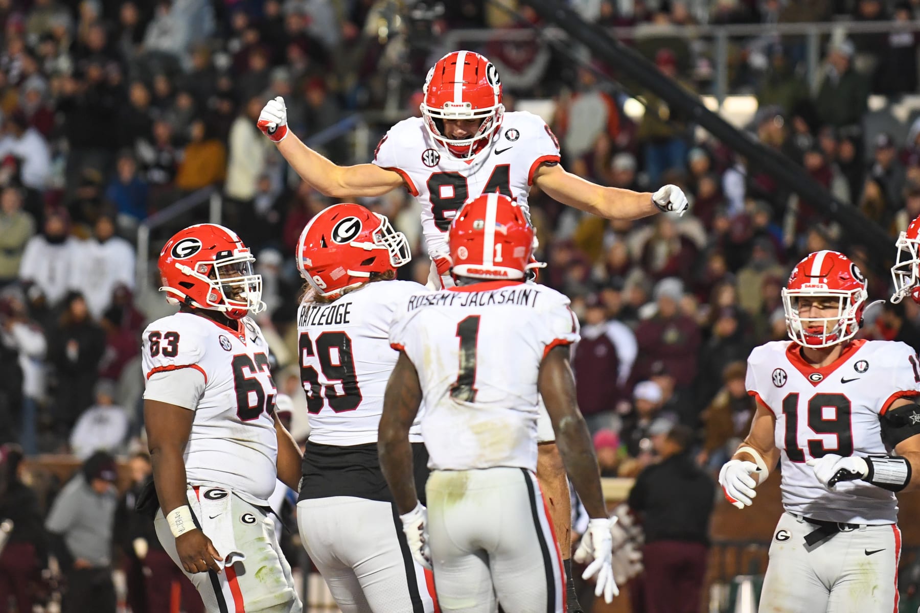 STARKVILLE, MS - NOVEMBER 12: Georgia wide receiver Ladd McConkey (84) is lifted by his teammates after scoring during the college football game between the Georgia Bulldogs and the Mississippi State Bulldogs on November 12, 2022 at Davis Wade Stadium in Starkville, MS. (Photo by Kevin Langley/Icon Sportswire via Getty Images)