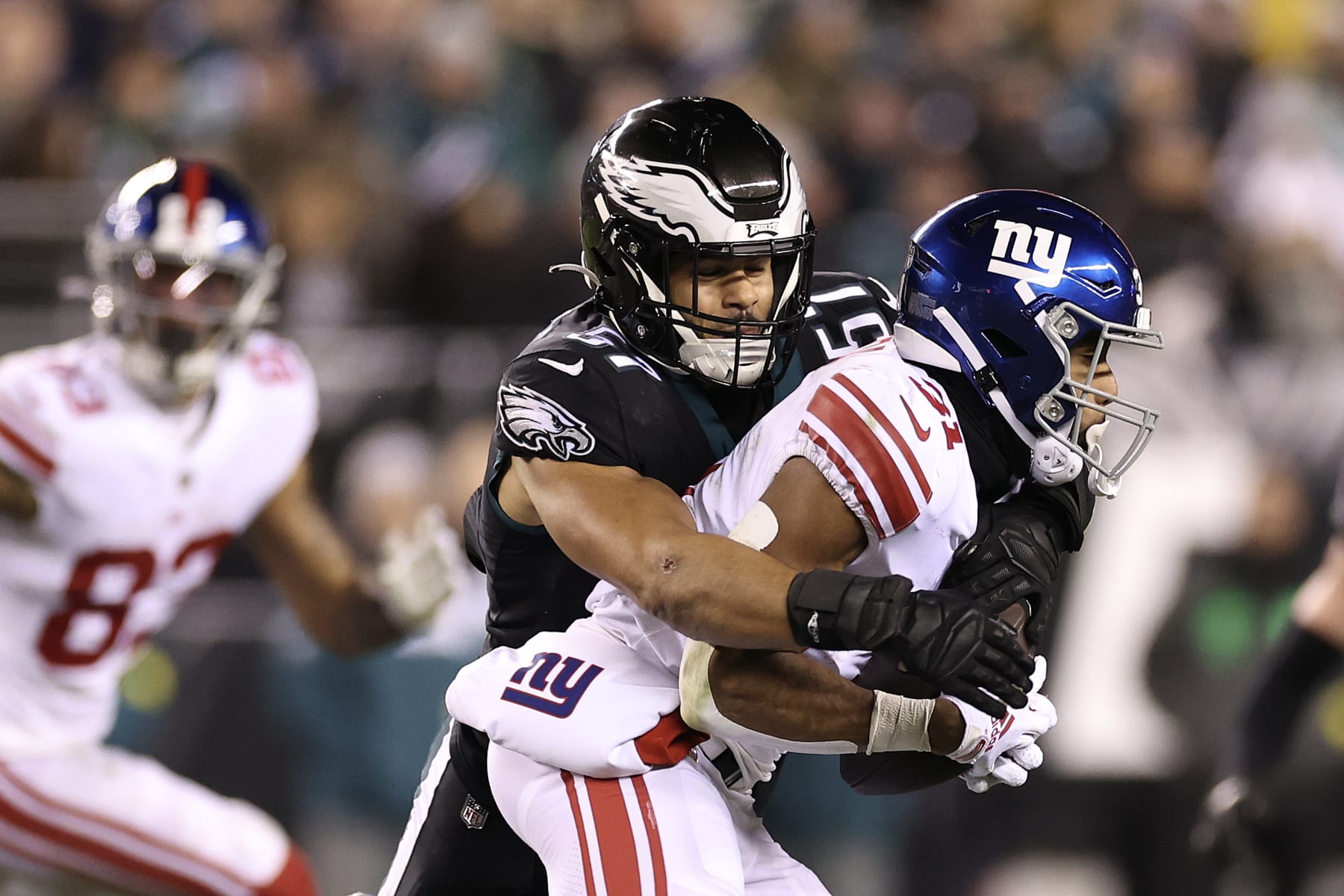 PHILADELPHIA, PENNSYLVANIA - JANUARY 08: T.J. Edwards #57 of the Philadelphia Eagles tackles Matt Breida #31 of the New York Giants at Lincoln Financial Field on January 08, 2023 in Philadelphia, Pennsylvania. (Photo by Tim Nwachukwu/Getty Images)
