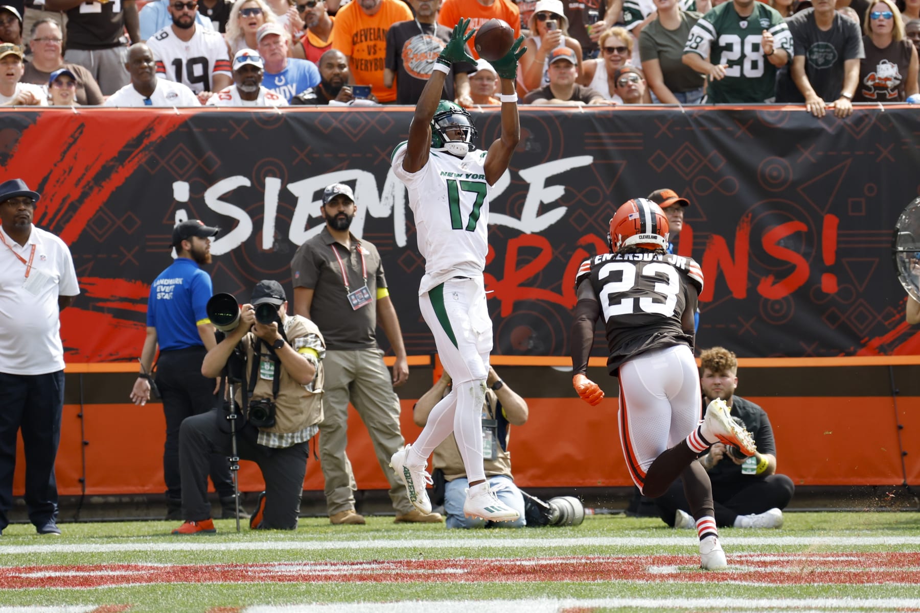 New York Jets wide receiver Garrett Wilson (17) makes a touchdown catch as Cleveland Browns cornerback Martin Emerson Jr. (23) defends during the first half of an NFL football game, Sunday, Sept. 18, 2022, in Cleveland. (AP Photo/Ron Schwane) New York Jets wide receiver Garrett Wilson (17) makes a touchdown catch as Cleveland Browns cornerback Martin Emerson Jr. (23) defends during the first half of an NFL football game, Sunday, Sept. 18, 2022, in Cleveland. (AP Photo/Ron Schwane)